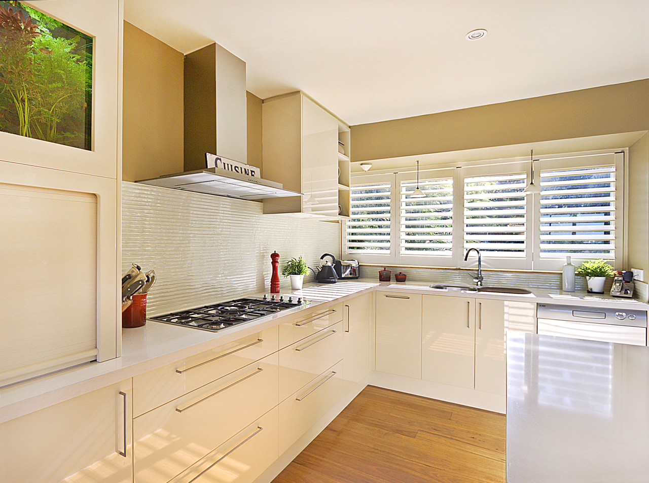 View of kitchen featuring wood floors, white bench cabinetry, countertop, cuisine classique, interior design, kitchen, property, real estate, room, white, orange