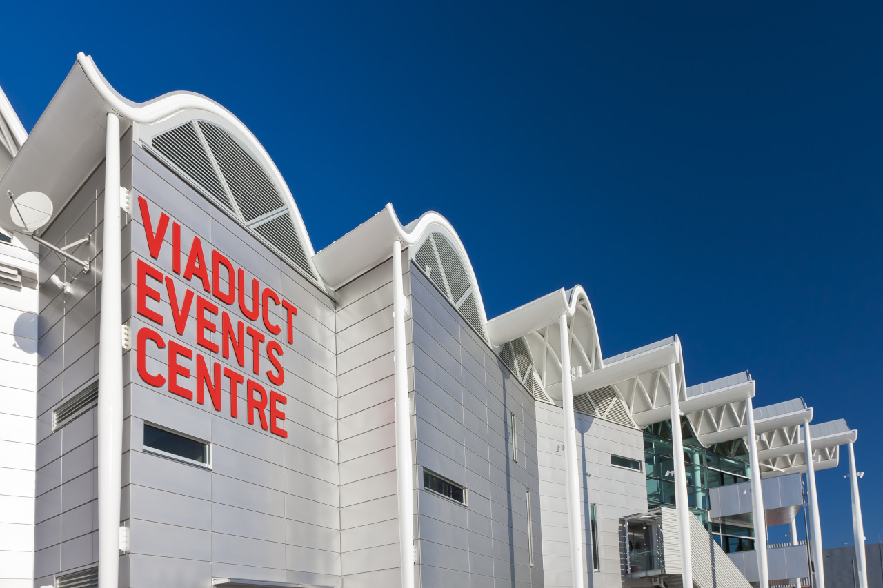 View of the Viaduct Events Center in Auckland's architecture, building, commercial building, corporate headquarters, daytime, facade, landmark, metropolitan area, mixed use, real estate, sky, structure, blue, gray