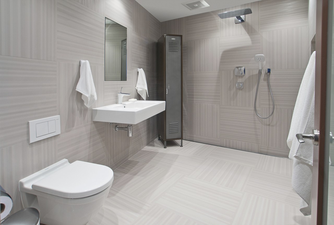 This bathroom was the winner of the small bathroom, floor, interior design, plumbing fixture, product design, room, tile, toilet, toilet seat, gray