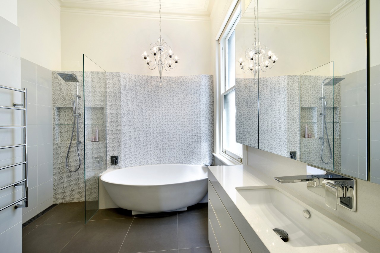 Bathroom with grey tiled flooring, white tub and architecture, bathroom, floor, interior design, plumbing fixture, product design, room, sink, tap, tile, white, gray