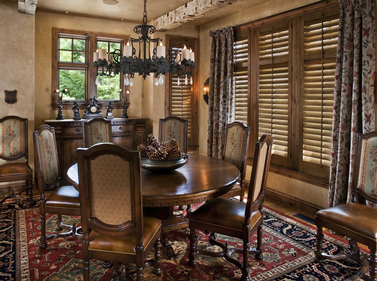 The interior of this home was designed by chair, dining room, furniture, home, interior design, living room, room, table, window, wood, brown