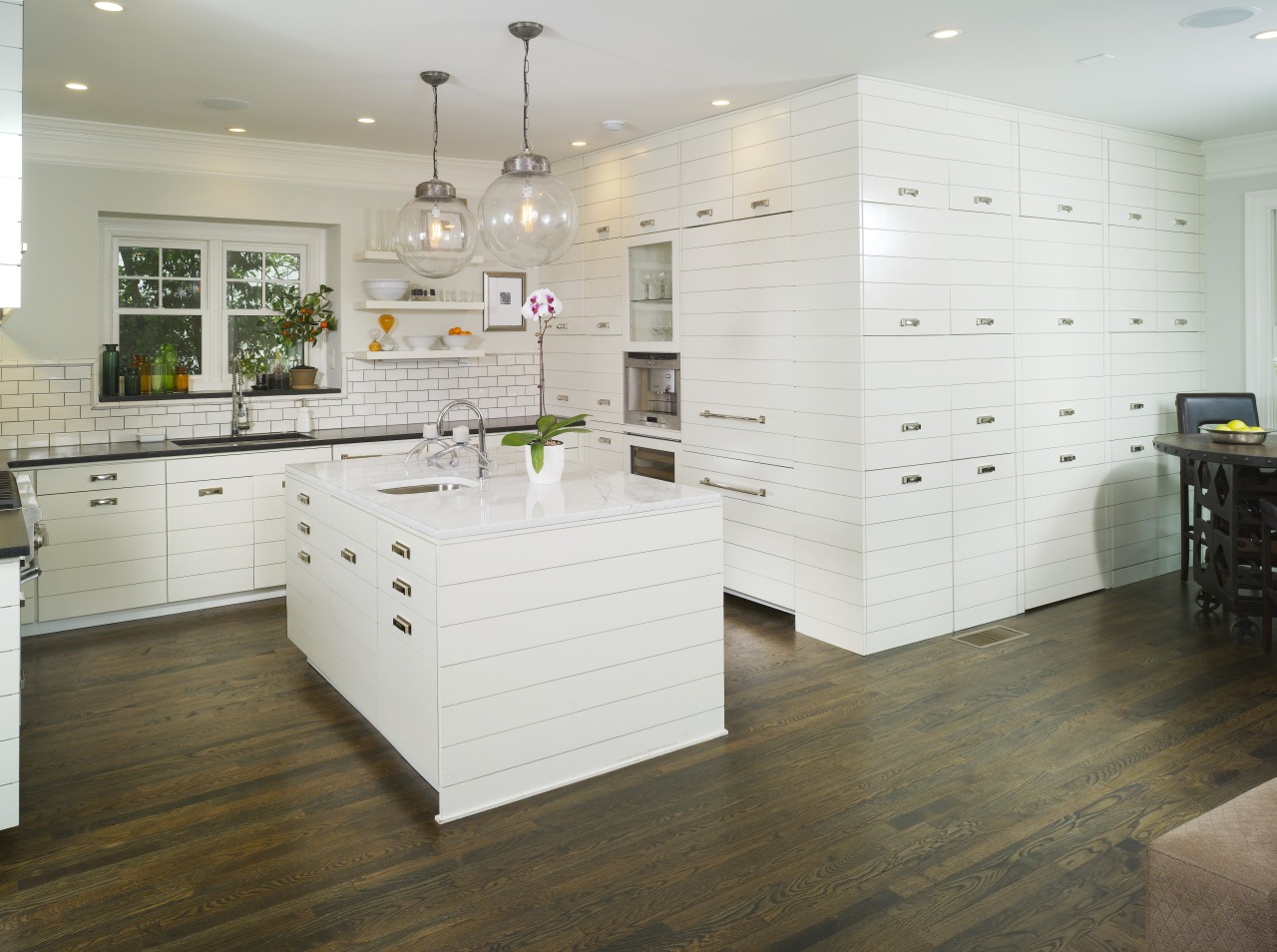 View of kitchen by Designer Willis Watts. Remodelled cabinetry, countertop, floor, flooring, furniture, hardwood, interior design, kitchen, laminate flooring, room, tile, wall, wood, wood flooring, white, gray