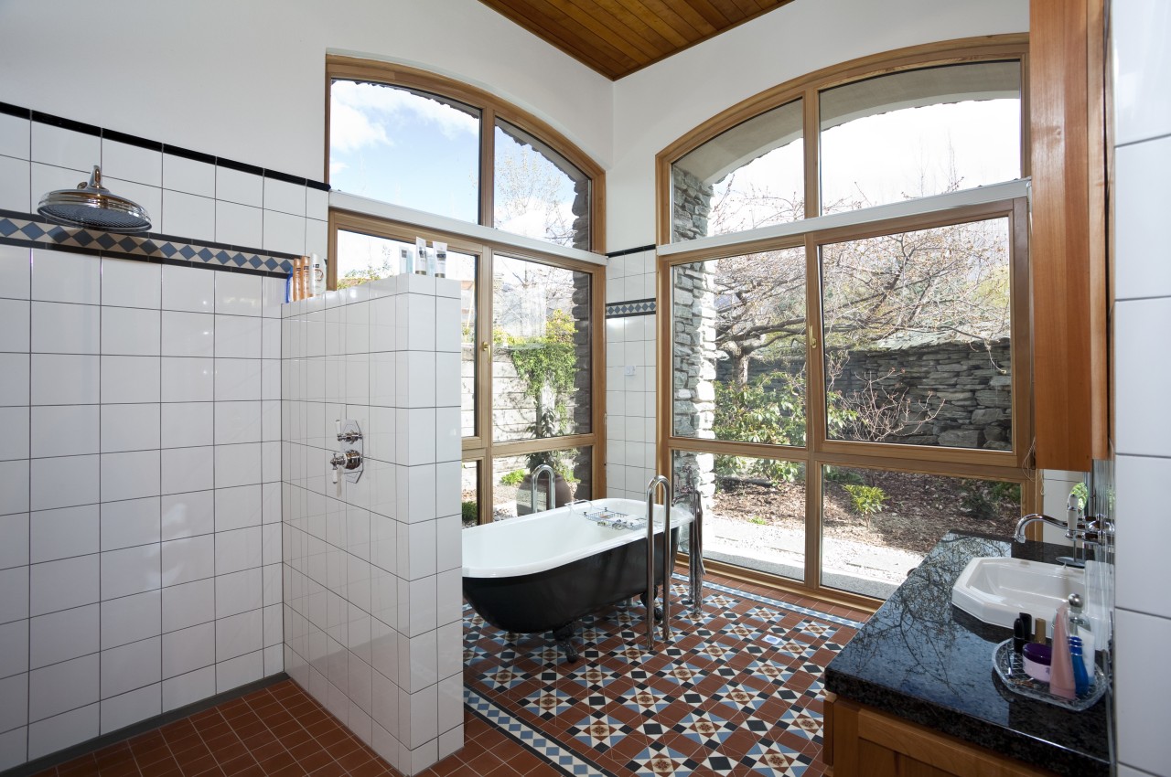 Bathroom with floor mat, free standing pub and bathroom, daylighting, estate, home, house, property, real estate, room, window, gray, white