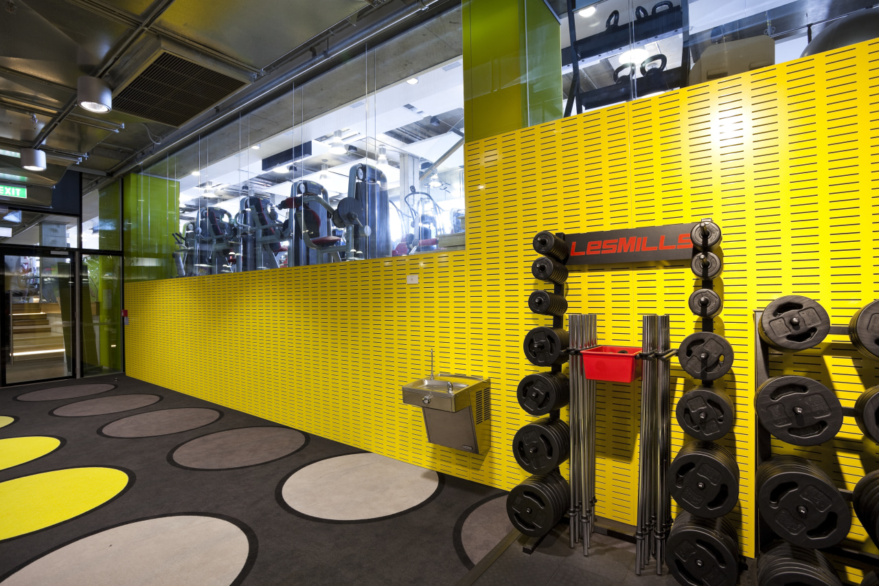 This Les Mills gym in the Britomart precinct interior design, room, structure, yellow, black