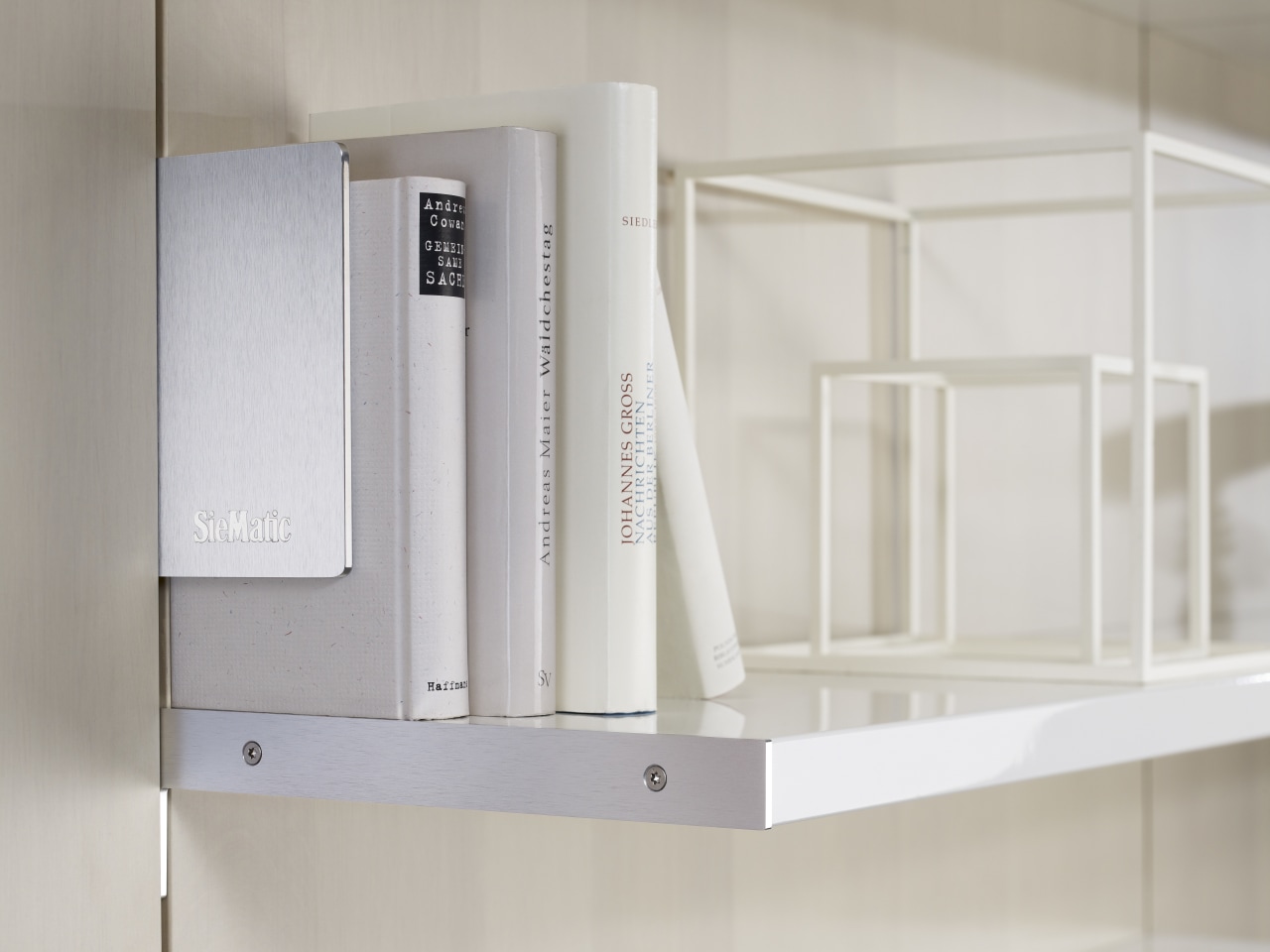 Photography of the "FloatingSpaces" system by SieMatic. furniture, product, product design, shelf, shelving, gray