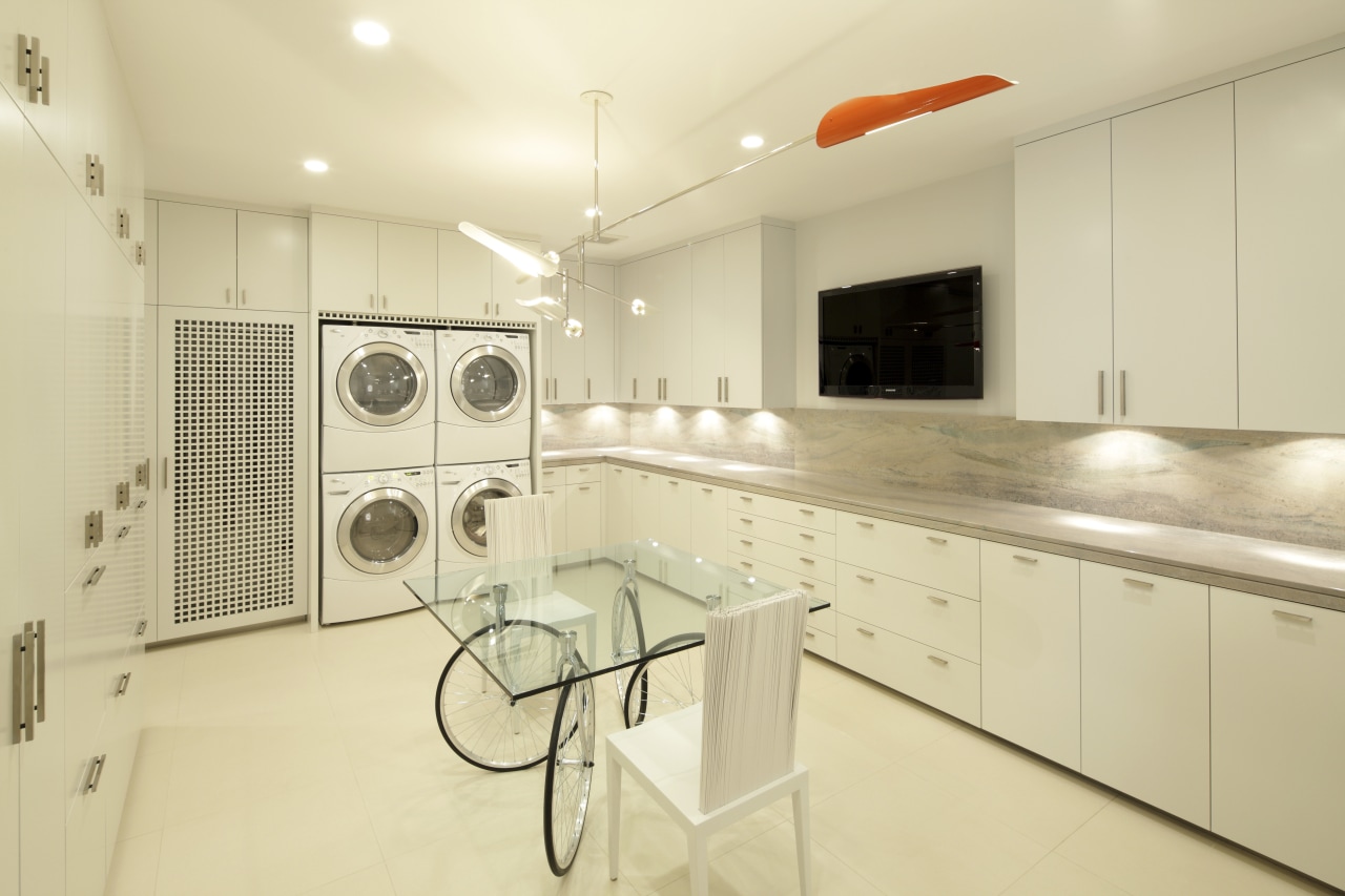 View of white laundry with white cabinetry, contemporary cabinetry, countertop, home, interior design, kitchen, laundry room, property, real estate, room, yellow