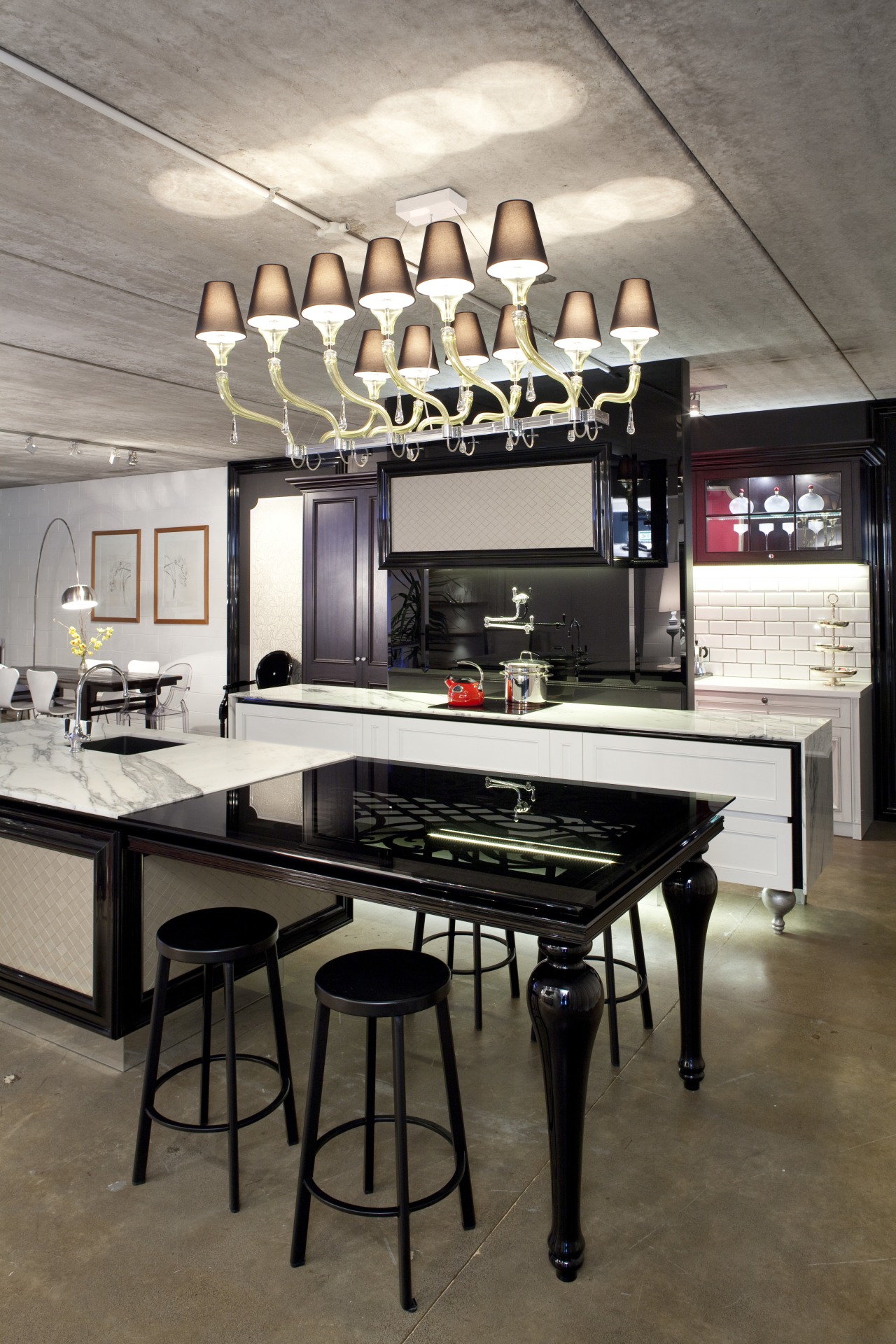 View of contemporary kitchen with lighting feature, black countertop, furniture, interior design, kitchen, table, gray