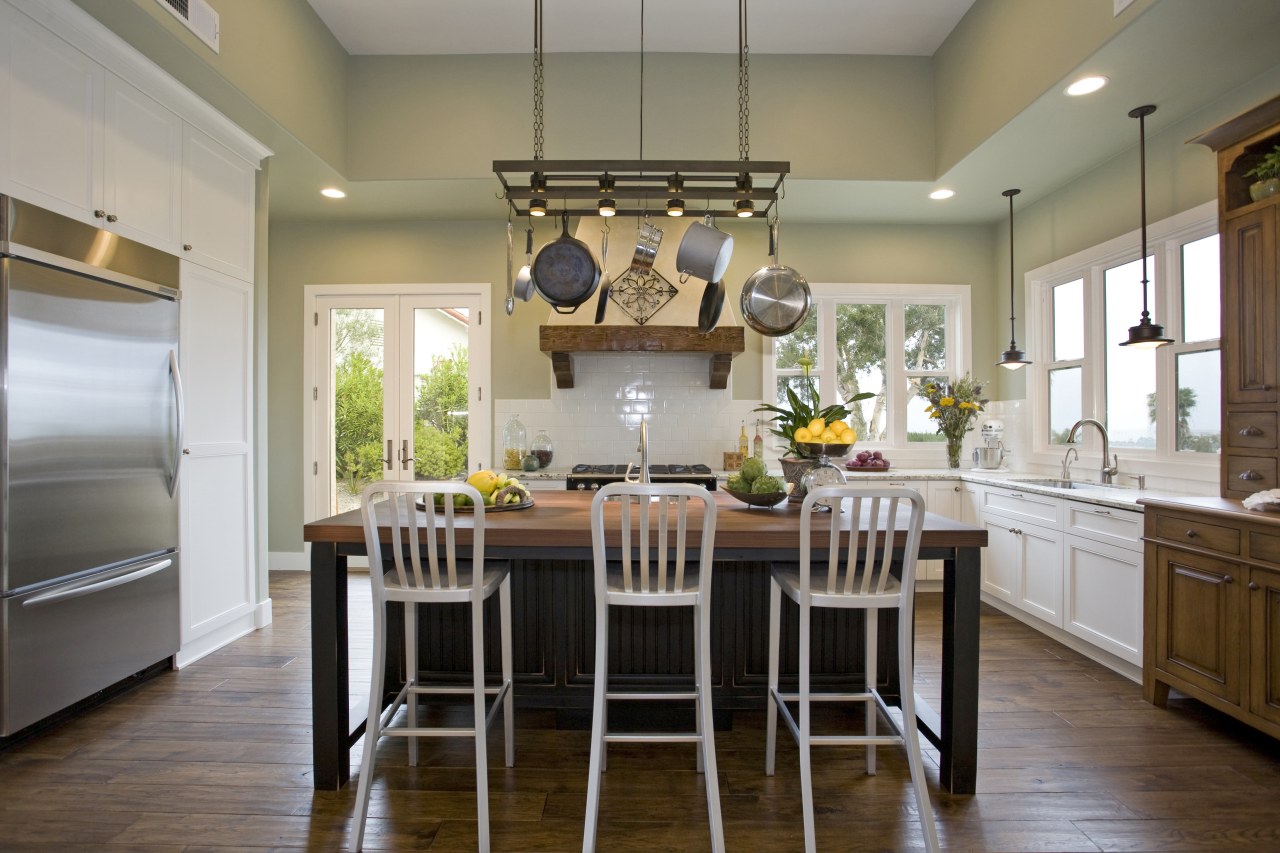 View of kitchen with wooden flooring, hanging pots cabinetry, ceiling, countertop, cuisine classique, dining room, interior design, kitchen, room, table, gray, brown