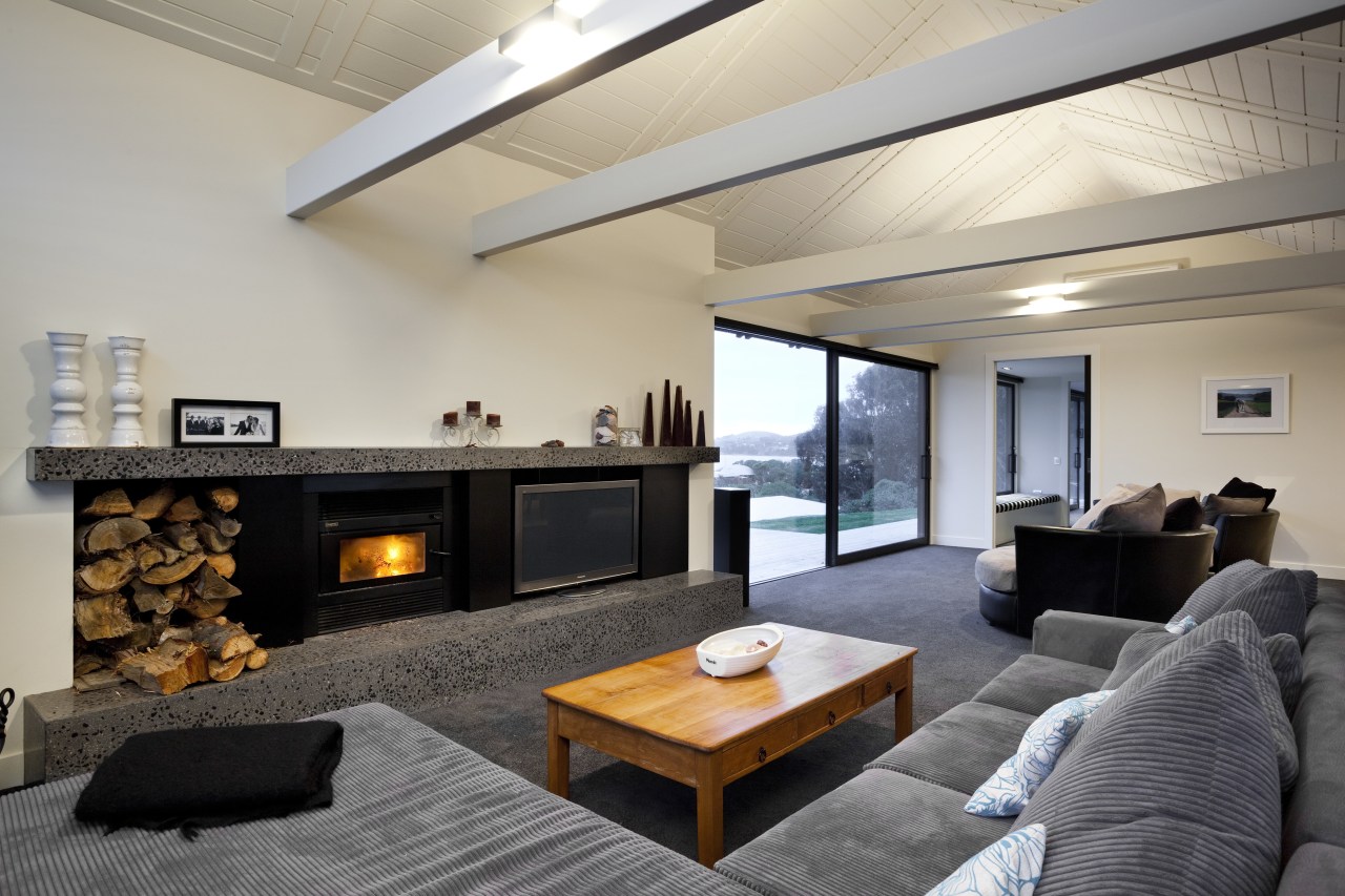 View of contemporary lounge with grey couch and architecture, ceiling, hearth, home, house, interior design, living room, property, real estate, room, gray