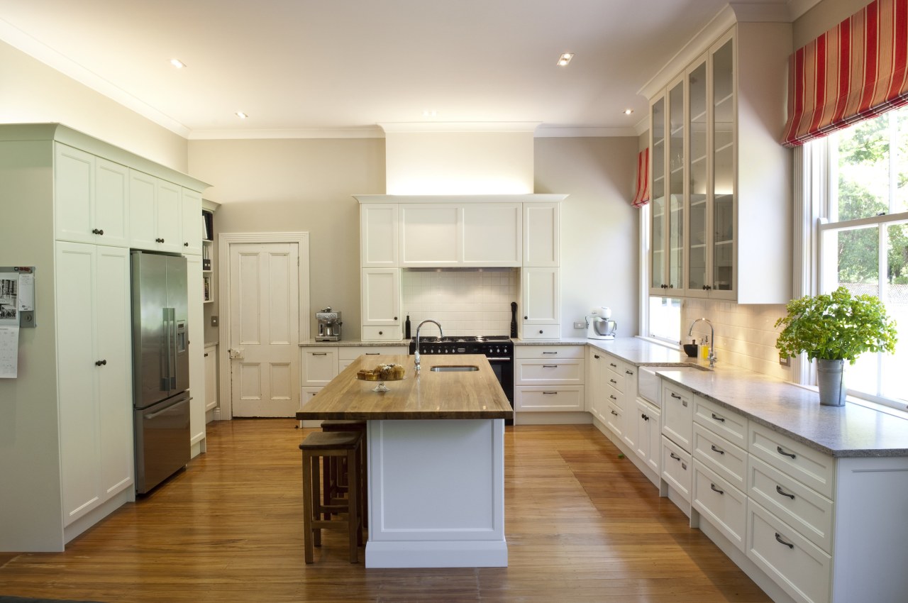 View of contemporary kitchen with wooden flooring and cabinetry, countertop, cuisine classique, floor, hardwood, interior design, kitchen, real estate, room, white