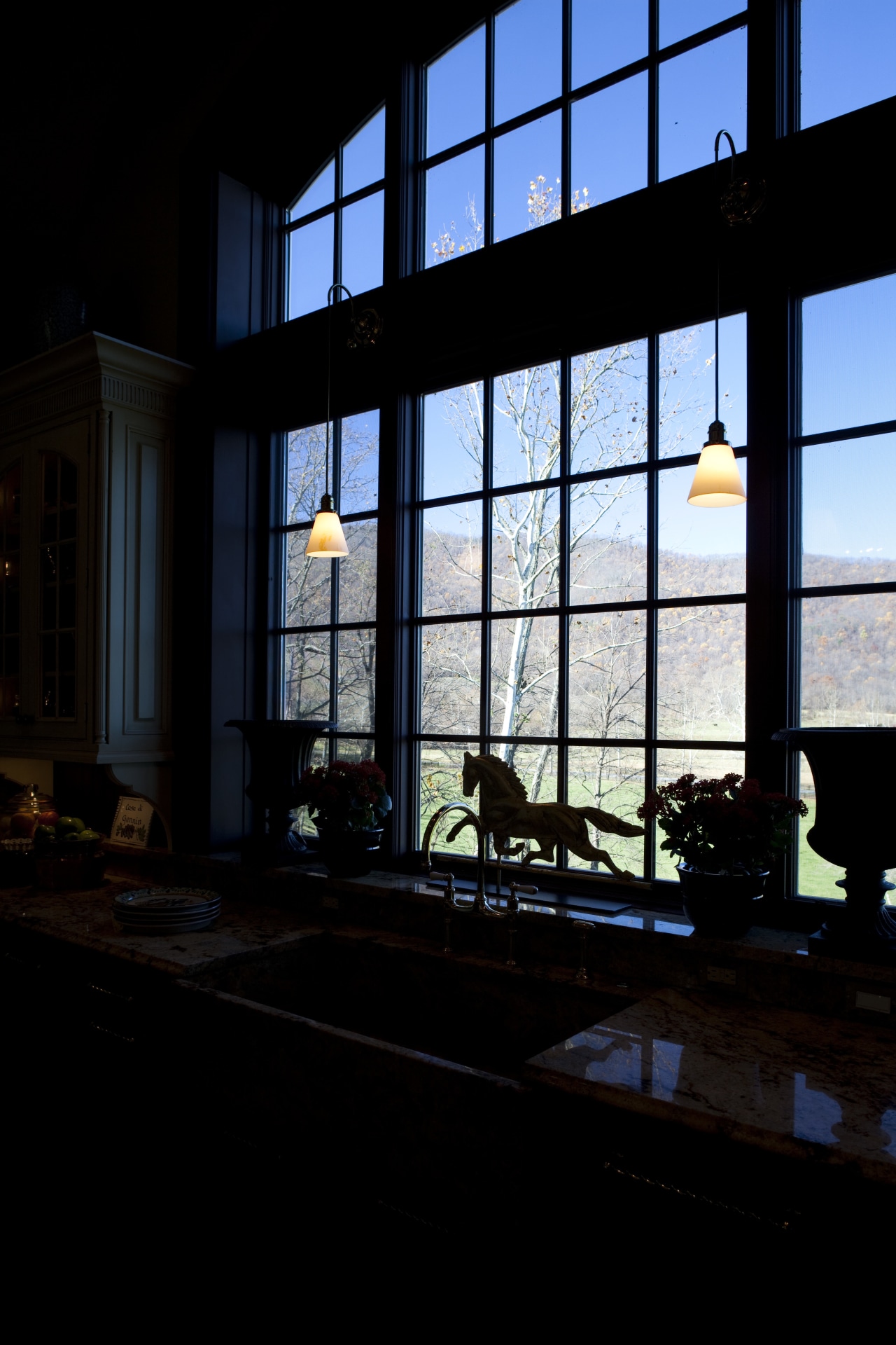 View of kitchen with wooden flooring, high ceilings architecture, building, darkness, daylighting, facade, glass, home, house, light, night, reflection, sky, structure, sunlight, window, black