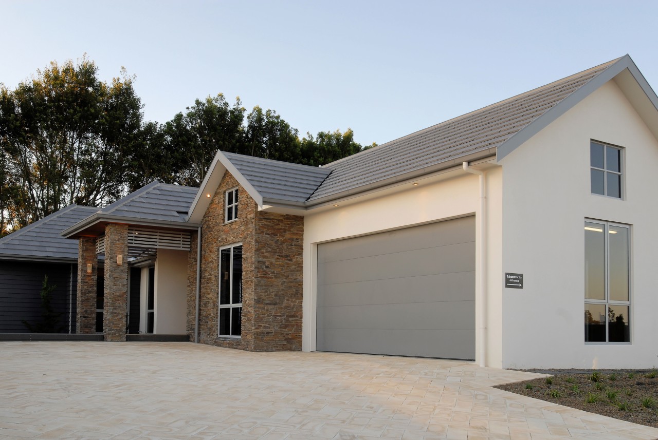 Monier Bricks & Roofing supplied and installed the building, elevation, estate, facade, garage, garage door, home, house, property, real estate, residential area, roof, siding, window, gray