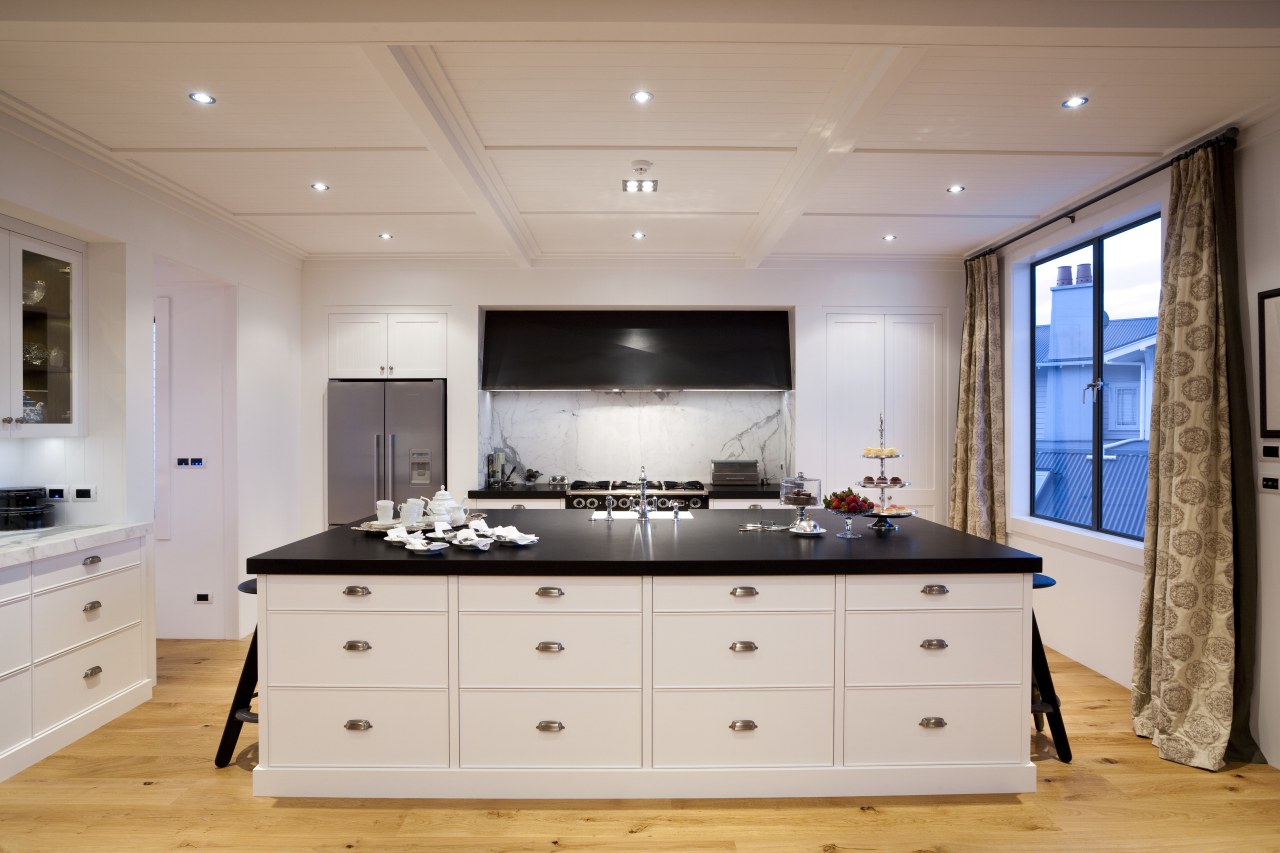 View of kitchen with wooden flooring, white cabinetry cabinetry, countertop, cuisine classique, floor, interior design, kitchen, room, gray