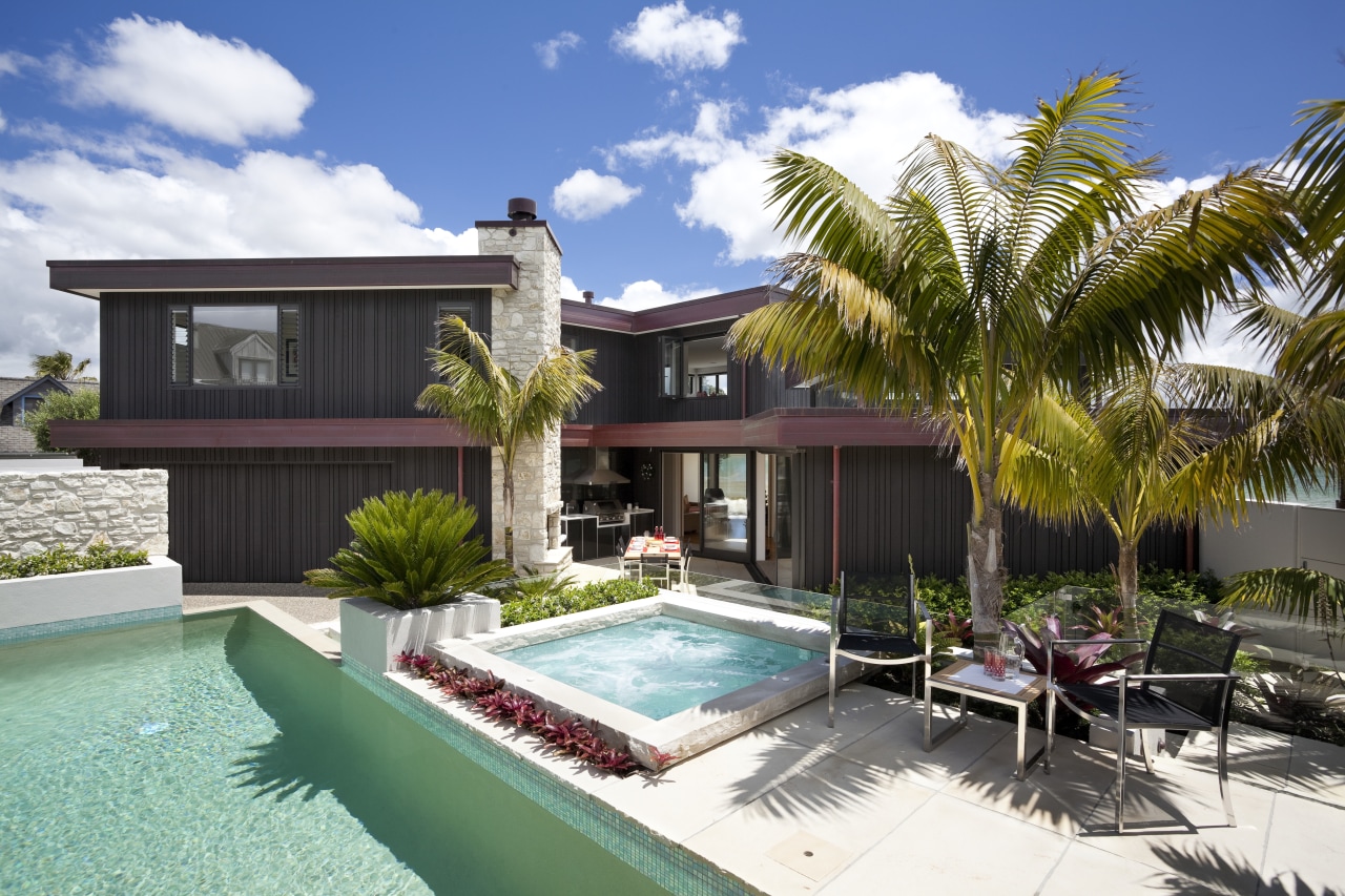 View of pool and patio area of contemporary cottage, elevation, estate, facade, home, house, palm tree, property, real estate, resort, swimming pool, villa