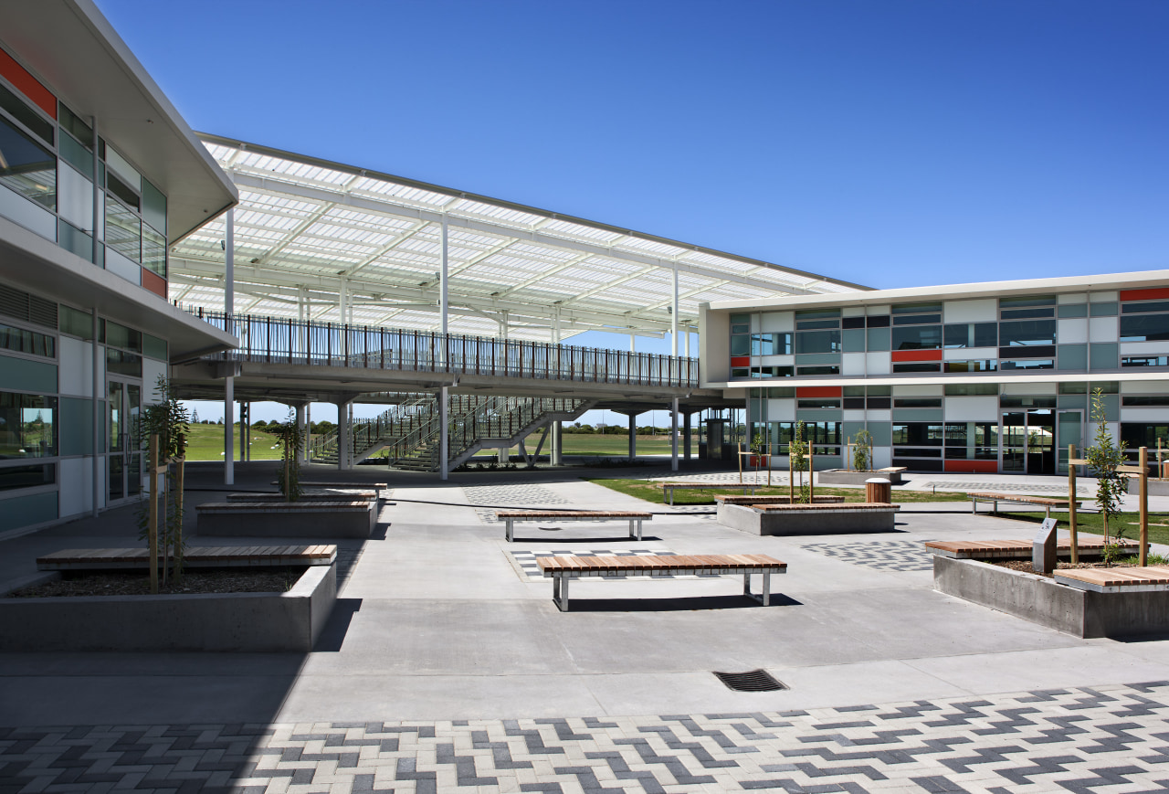 View of courtyard with seating. architecture, building, commercial building, corporate headquarters, metropolitan area, mixed use, real estate, residential area, urban design