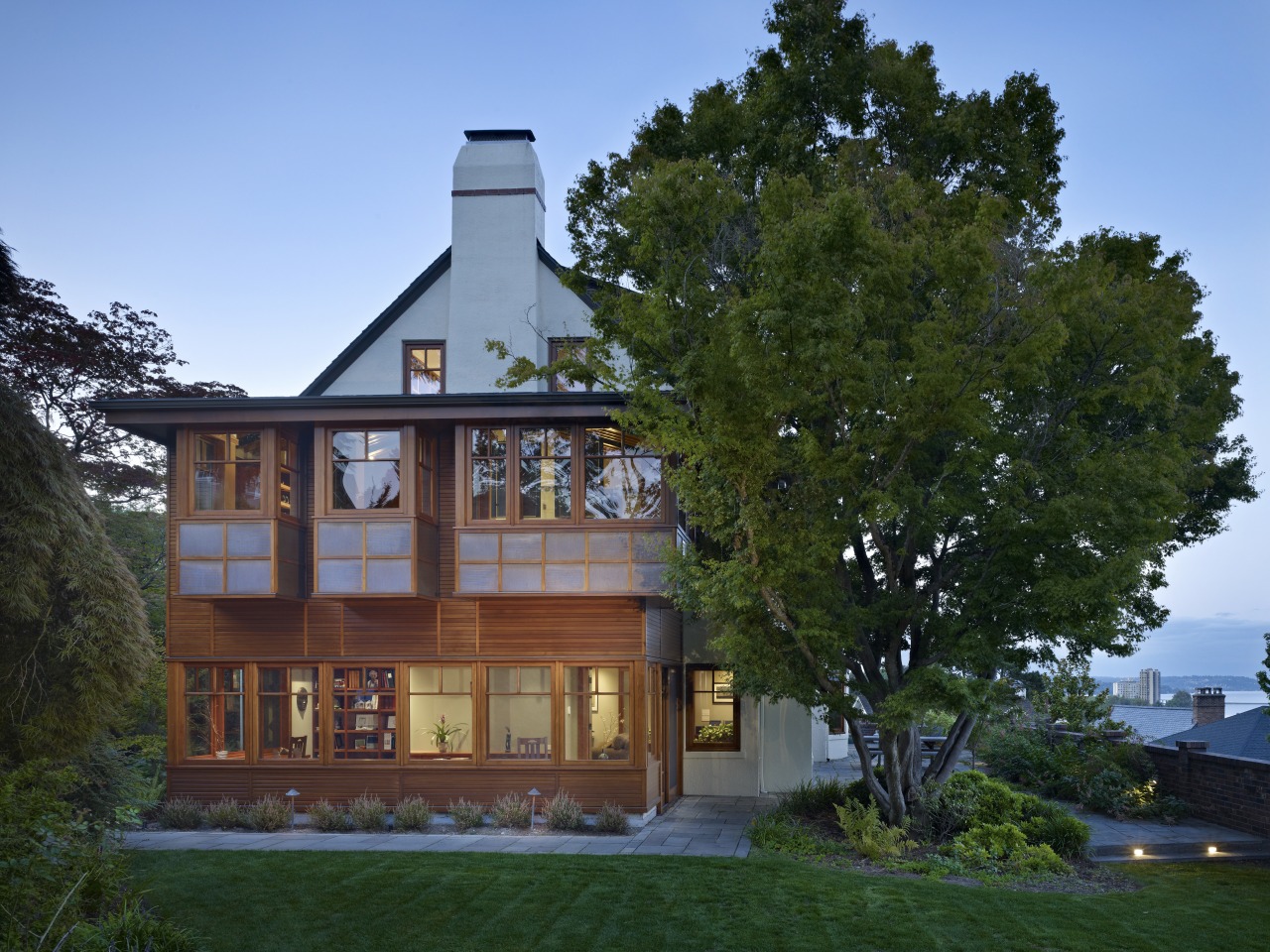 Exterior of house with wooden cladding and chimney. building, cottage, estate, facade, farmhouse, home, house, mansion, property, real estate, tree, teal