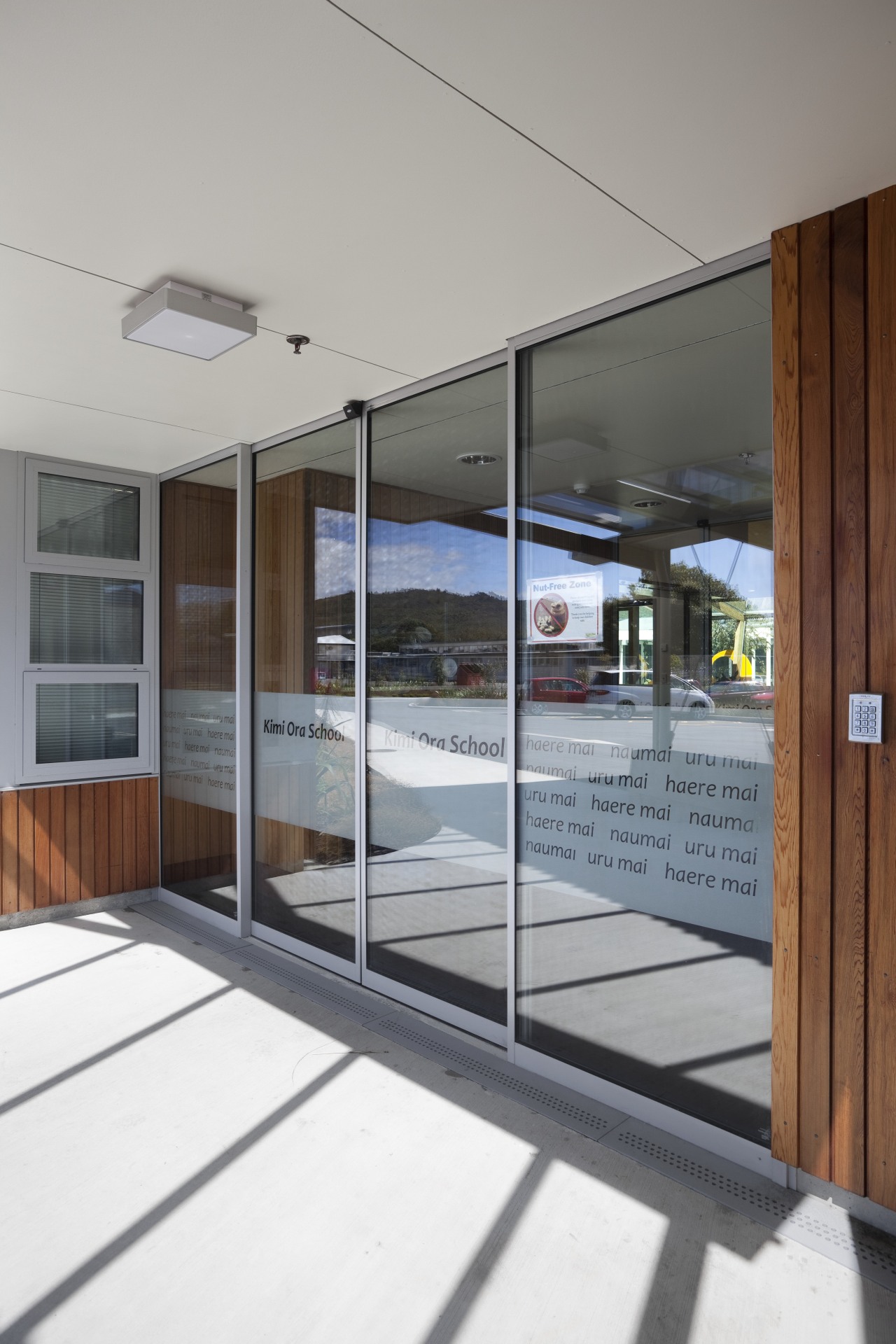 View of doorway. architecture, door, glass, house, real estate, window, gray, white