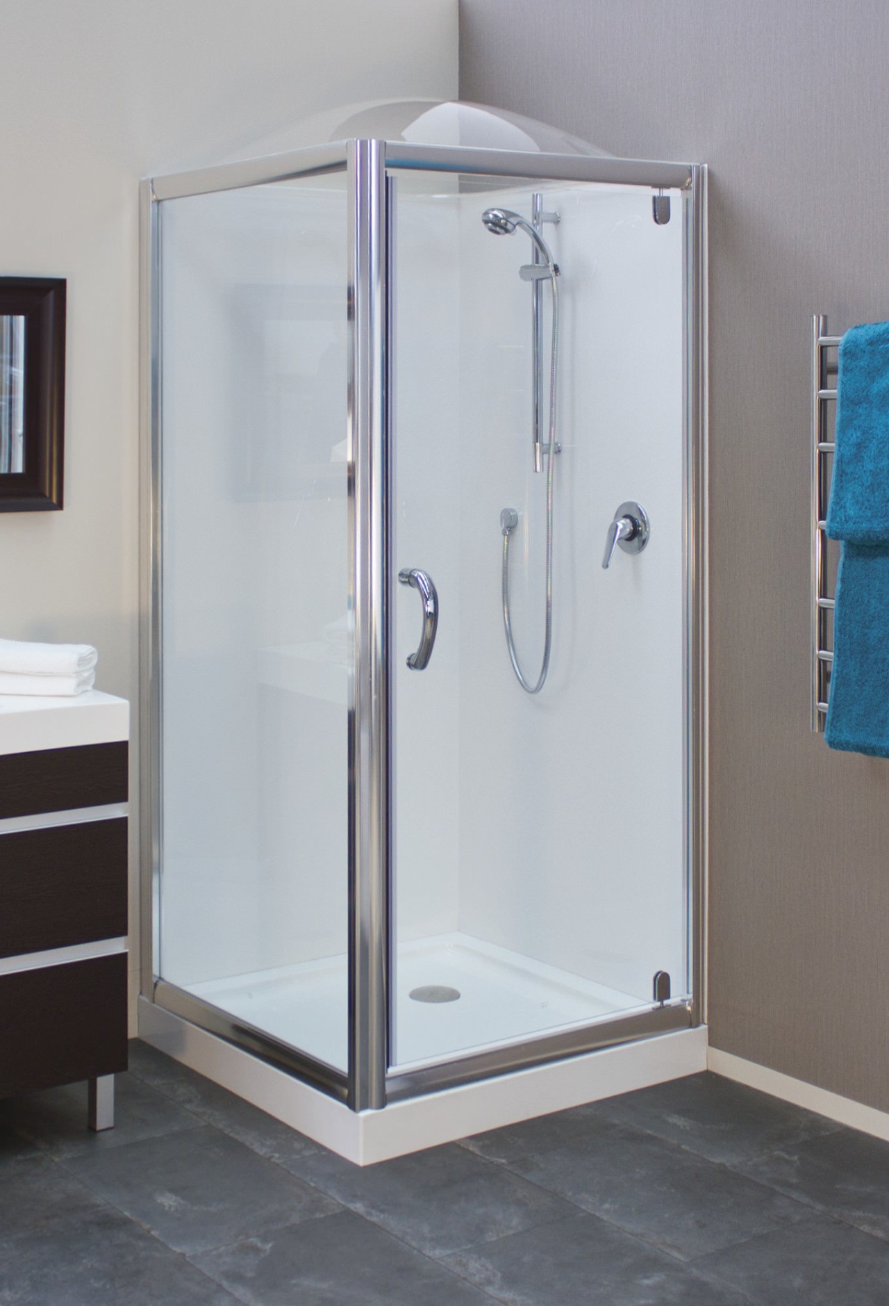 Shower enclosure with grey flooring. plumbing fixture, shower, gray