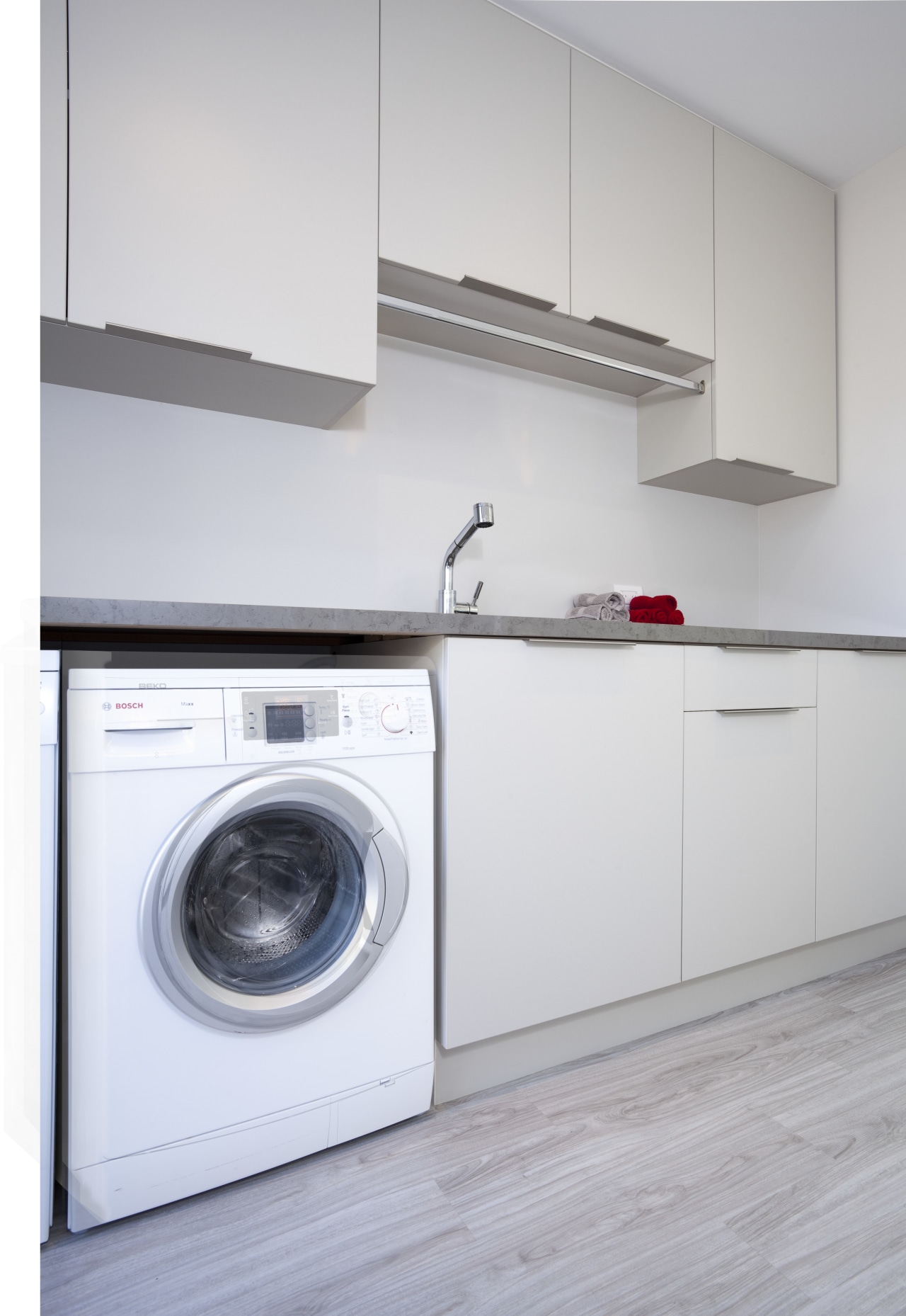 Laundry with white appliances and white cupboards. clothes dryer, home appliance, kitchen, laundry, laundry room, major appliance, product, product design, room, washing machine, gray, white
