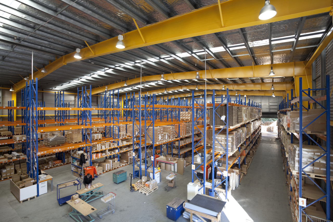 Interior of factory with yellow ceiling beams. factory, industry, inventory, manufacturing, warehouse