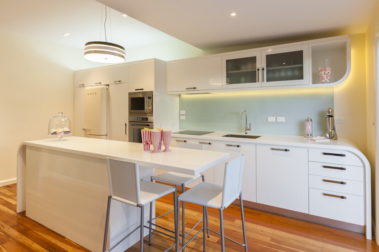 Contemporary kitchen with wooden flooring and white cupboards. cabinetry, countertop, cuisine classique, interior design, kitchen, property, real estate, room, orange, gray