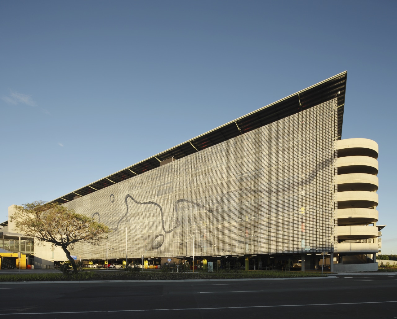 Exterior with grey wall architecture, building, commercial building, corporate headquarters, daytime, facade, headquarters, infrastructure, landmark, metropolitan area, sky, structure, teal