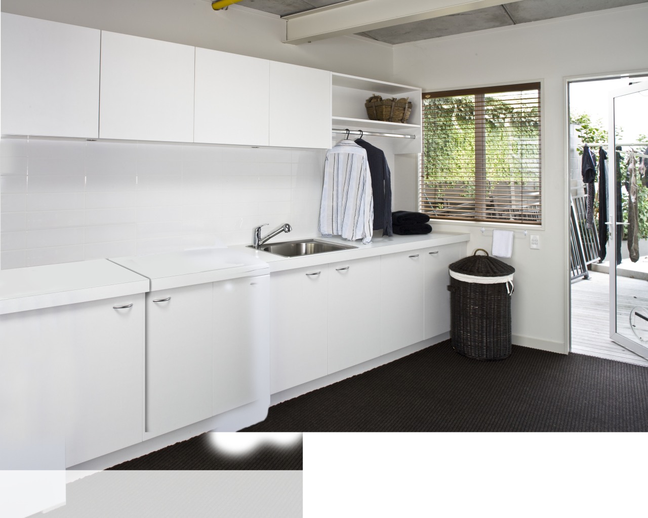 Laundry with white appliances and white cupboards. countertop, floor, interior design, kitchen, product design, room, white
