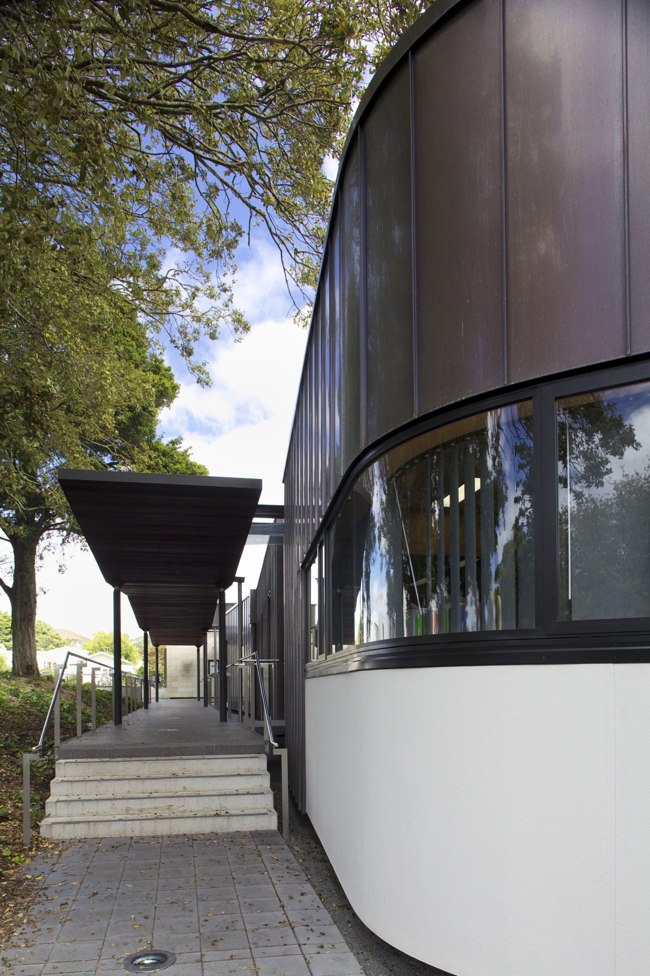 Exterior with curved windows. architecture, building, facade, house, reflection, tree, black, gray