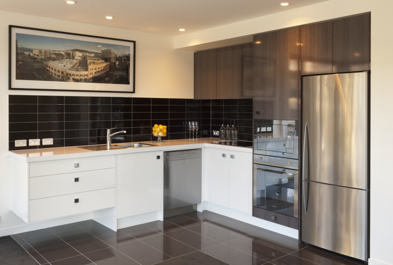 Kitchen with stainless fridge and white drawers and cabinetry, countertop, cuisine classique, interior design, kitchen, property, real estate, room, white