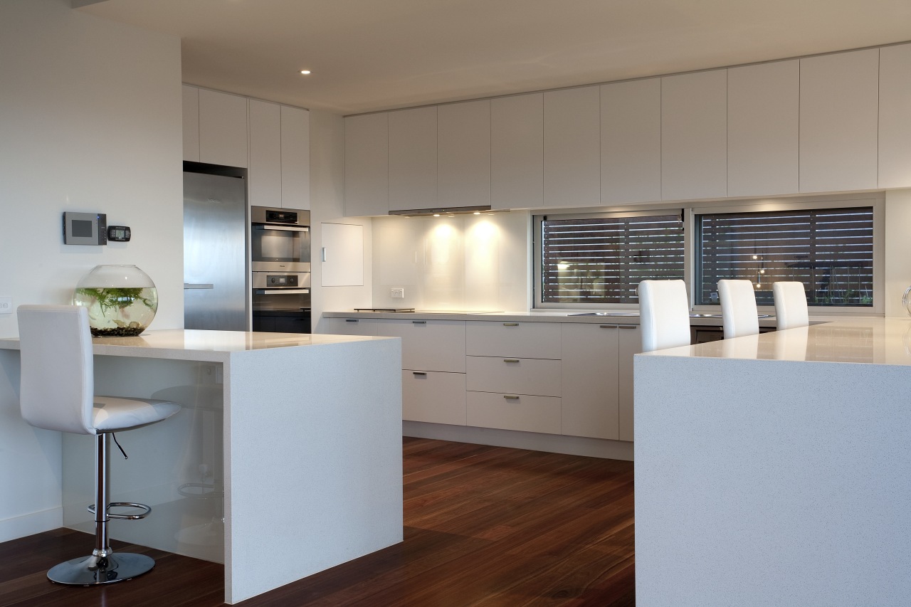 Contemporary kitchen with wooden flooring, white drawers and architecture, cabinetry, countertop, cuisine classique, floor, interior design, kitchen, real estate, gray