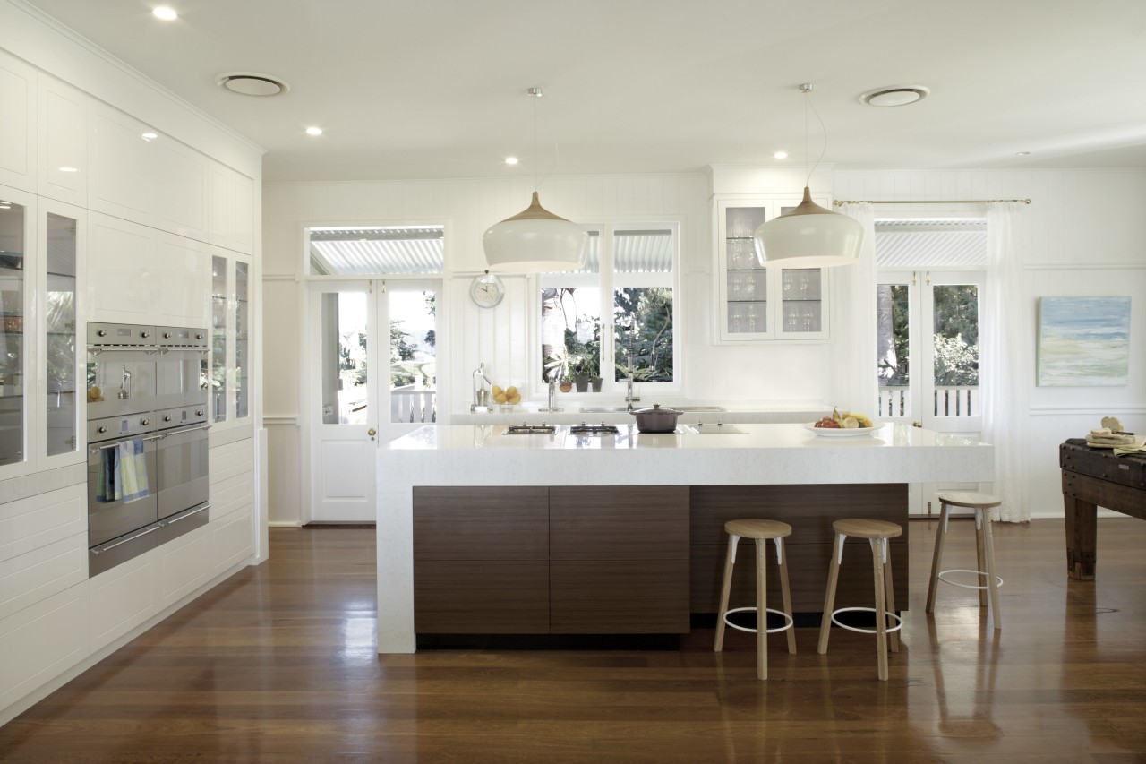 The white surfaces in this renovated kitchen appear cabinetry, ceiling, countertop, cuisine classique, floor, flooring, home, interior design, kitchen, real estate, room, wood flooring, gray, white