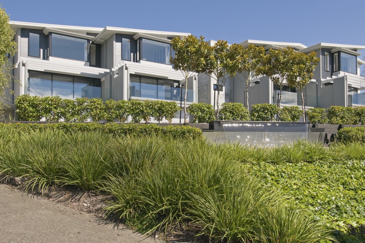 The Moorings in Taupo by Haimes Building townhouses estate, grass, grass family, home, house, plant, property, real estate, residential area, brown