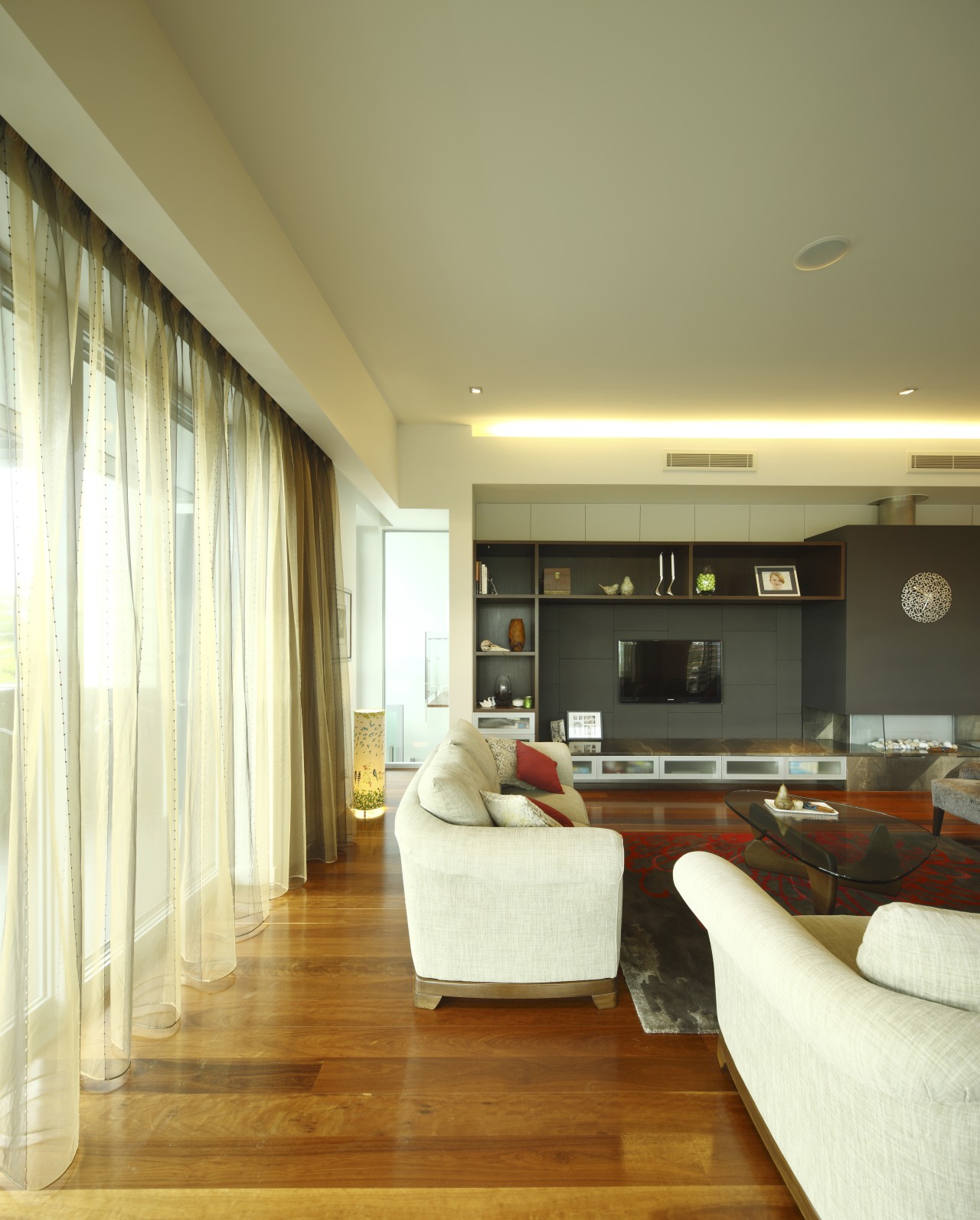 Living area with white furnature and polished floors ceiling, floor, flooring, hardwood, interior design, living room, real estate, room, wall, wood flooring, orange, brown, yellow