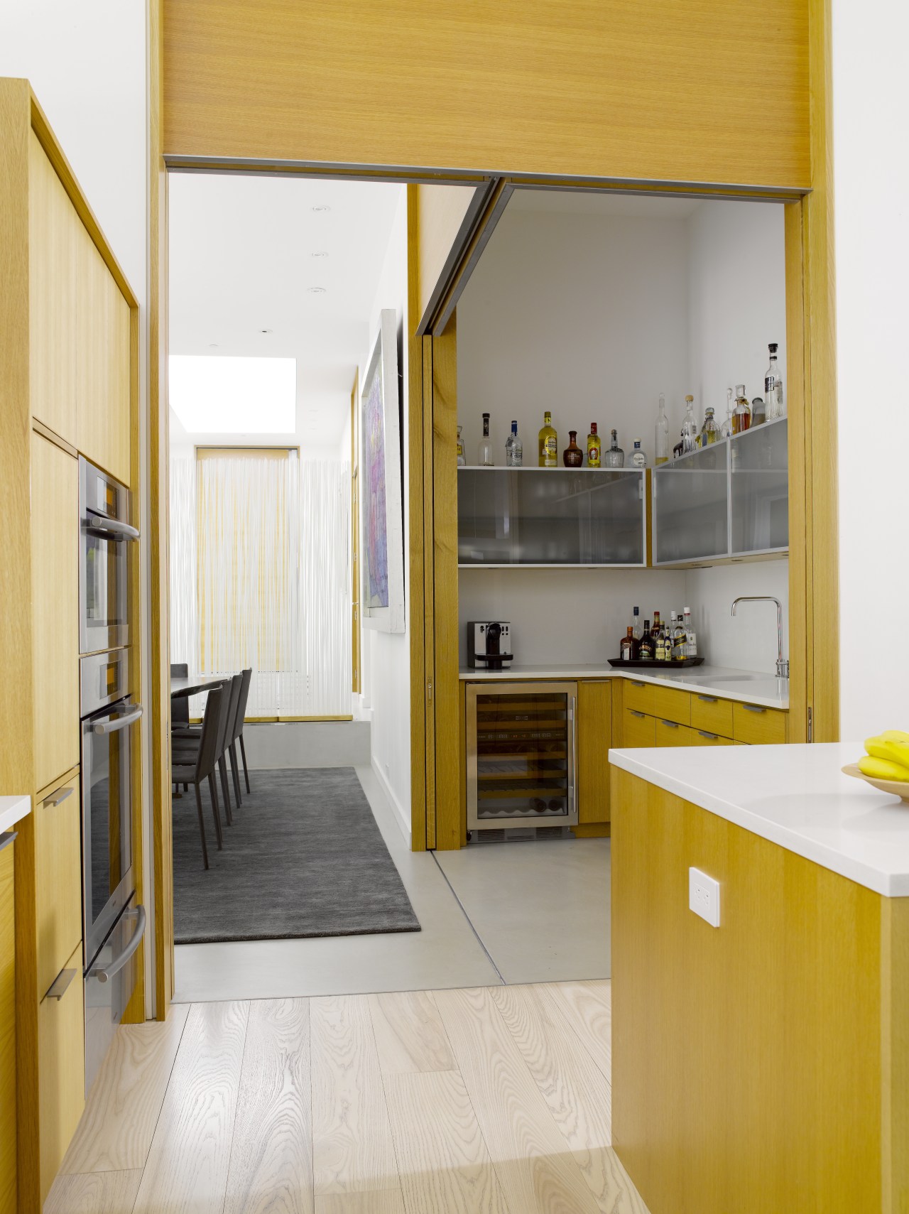 Seen here is a kitchen designed by Geoffrey architecture, cabinetry, countertop, cuisine classique, floor, flooring, house, interior design, kitchen, room, wood flooring, white, orange