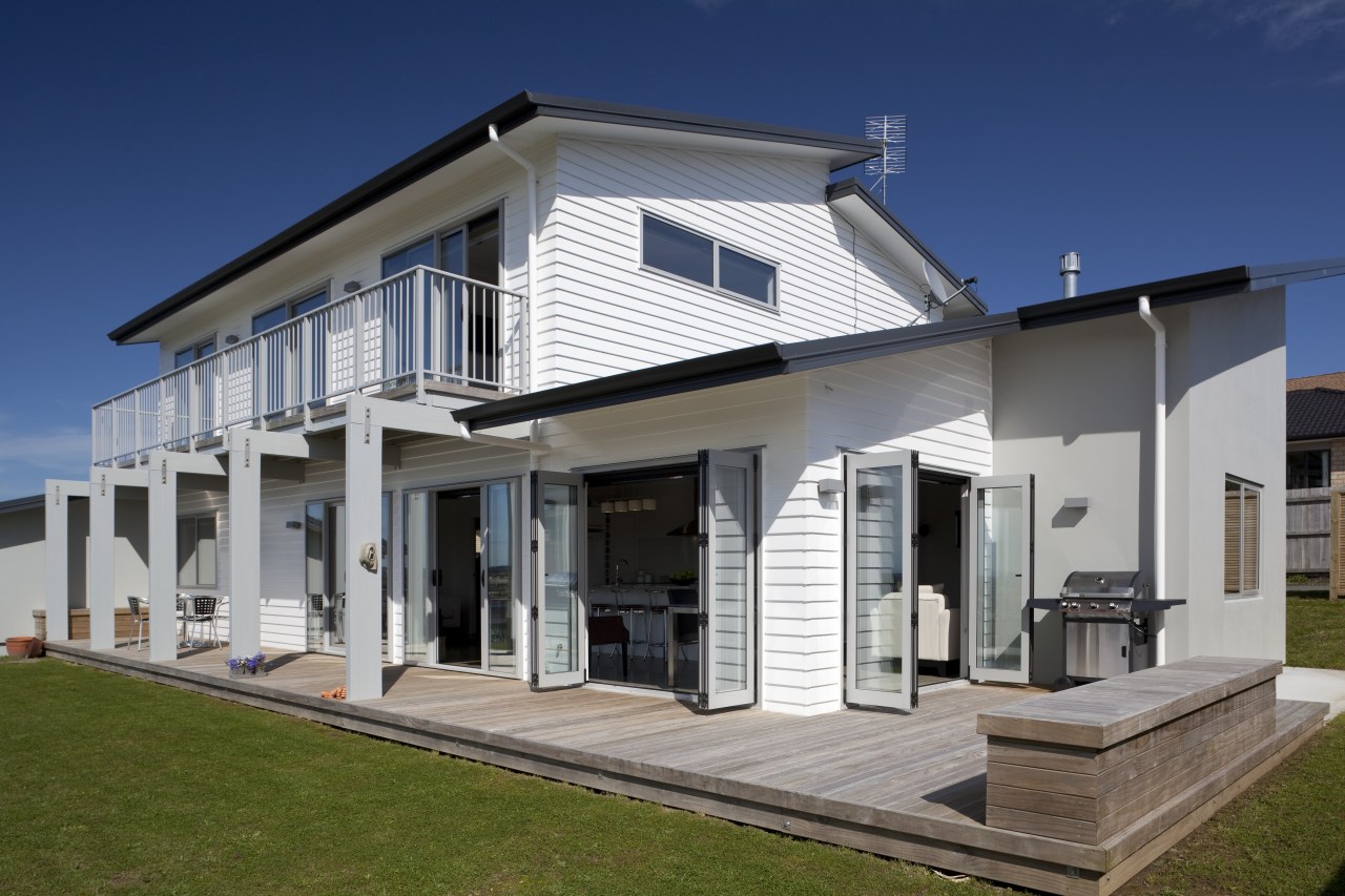 The Palliside weatherboard cladding system provides a clean, building, elevation, estate, facade, home, house, official residence, property, real estate, residential area, siding, villa, window, gray, blue