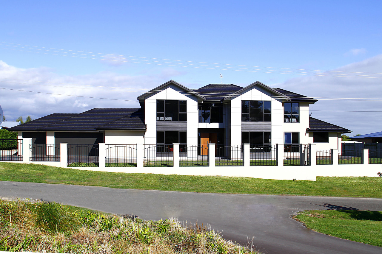 This home won the Registered Master Builders House building, cottage, elevation, estate, facade, farmhouse, home, house, land lot, neighbourhood, property, real estate, residential area, sky, suburb, teal