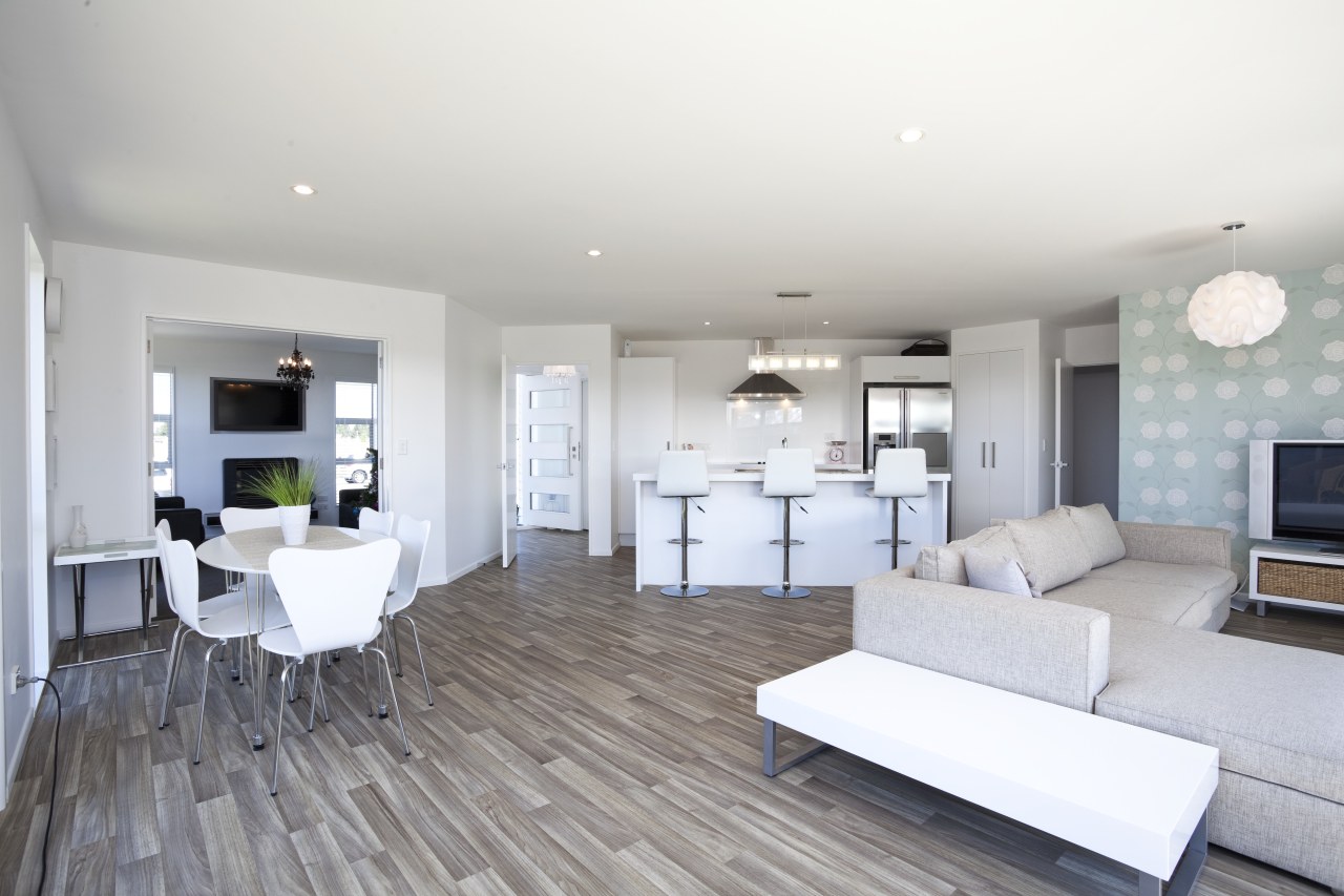 Interior view of a Stonewood Home. Seen is apartment, floor, flooring, home, interior design, living room, property, real estate, room, white