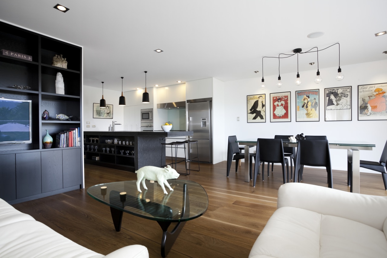 The island in this open-plan family living area apartment, interior design, living room, room, white