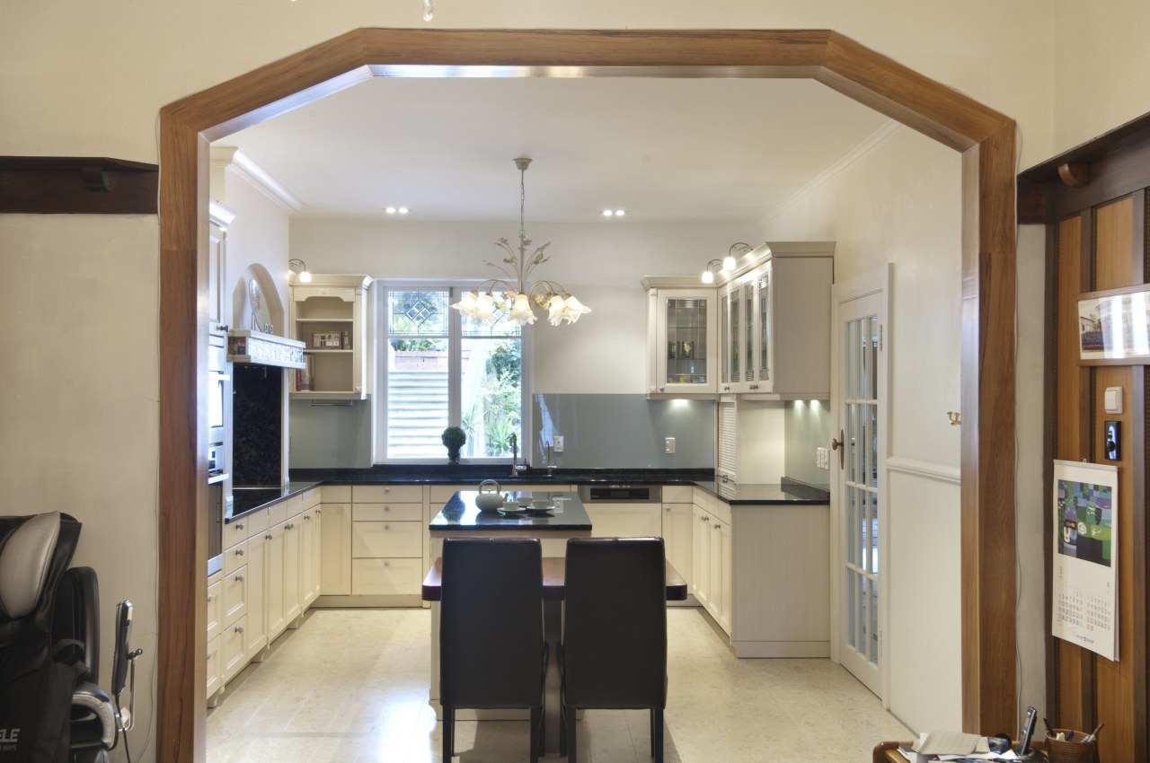 The island tabletop in this contemporary classic kitchen cabinetry, ceiling, countertop, cuisine classique, interior design, kitchen, property, real estate, room, gray