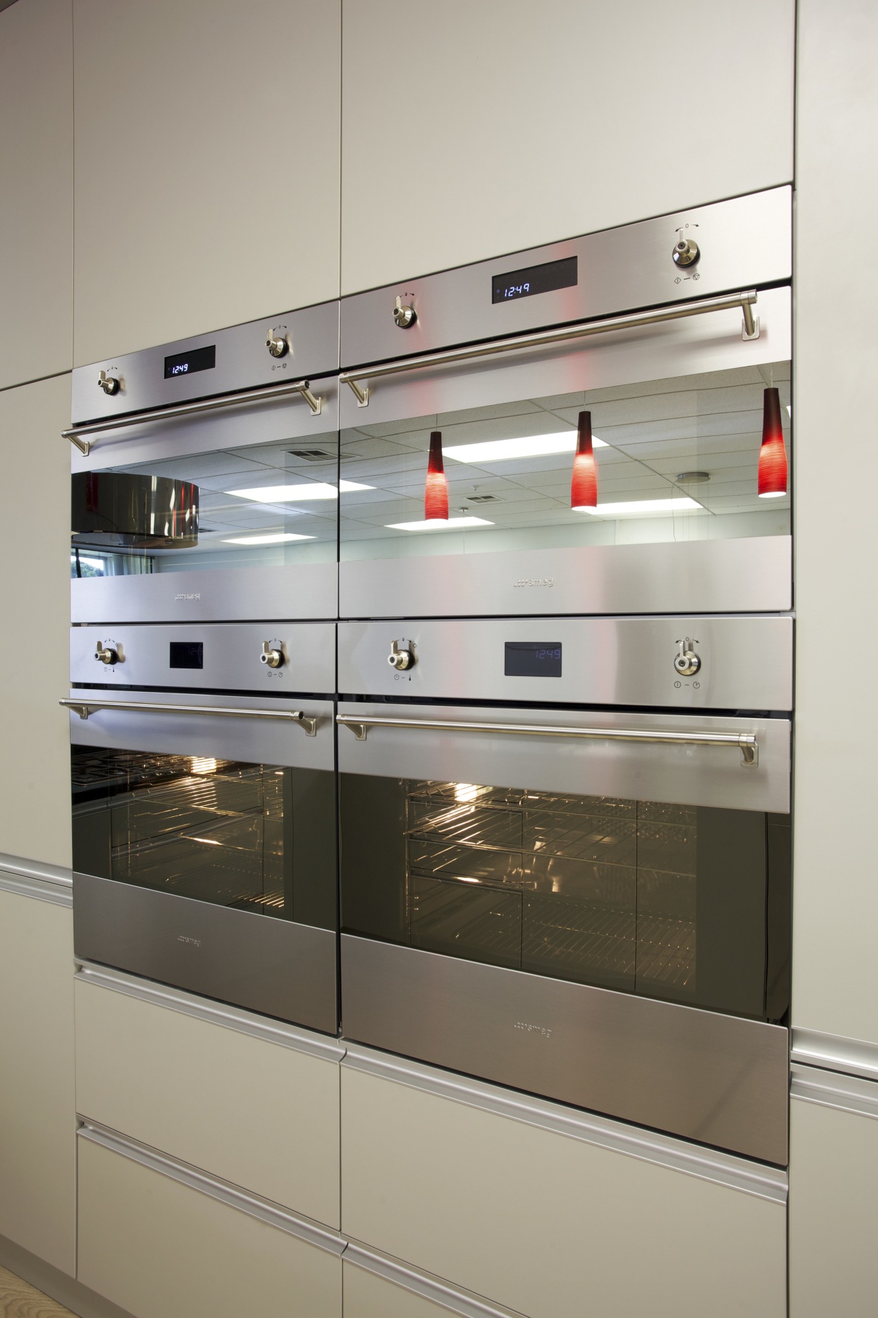 Smeg appliances in Inside Vision kitchen showroom display case, gas stove, glass, home appliance, kitchen, kitchen appliance, kitchen stove, major appliance, oven, shelving, gray