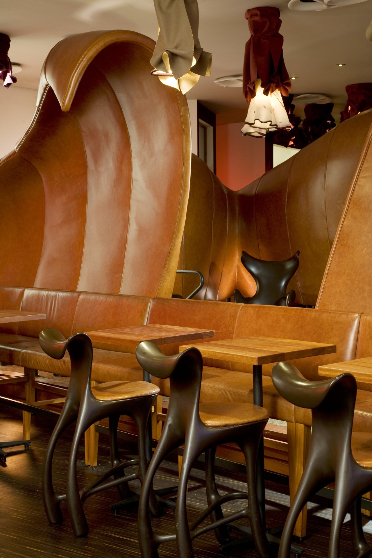 The lounge and dining areas in the Américas chair, flooring, furniture, interior design, restaurant, table, wood, brown