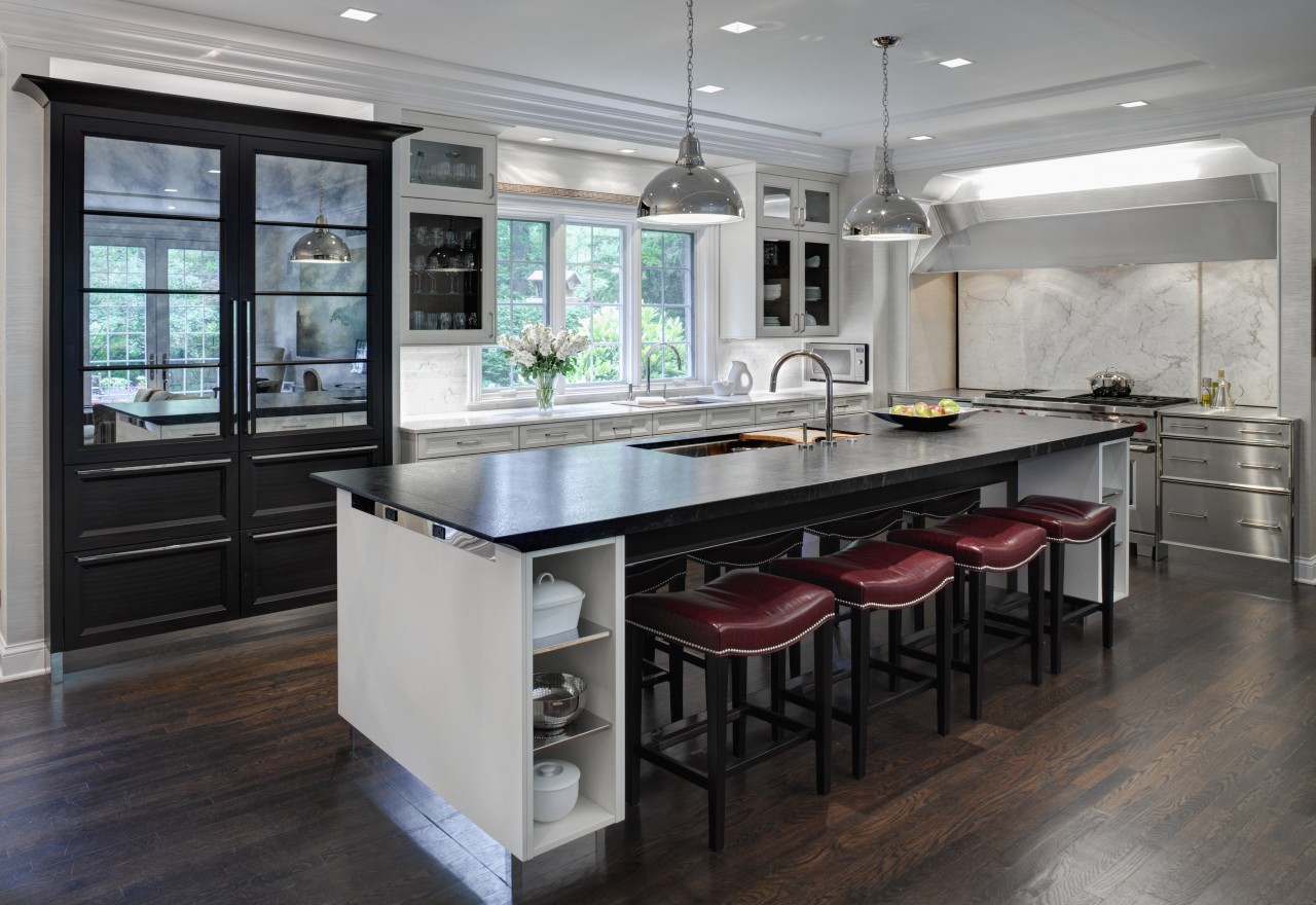 This Mick De Giulio  kitchen responds to cabinetry, countertop, cuisine classique, floor, flooring, interior design, kitchen, room, table, gray, black