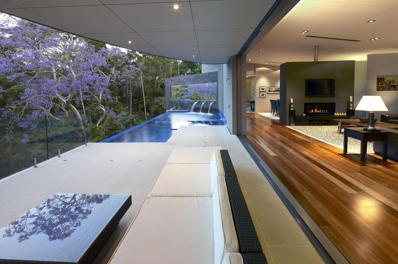 A mirror attached to the bluestone-clad blade wall architecture, daylighting, estate, home, house, interior design, real estate, swimming pool, gray, brown