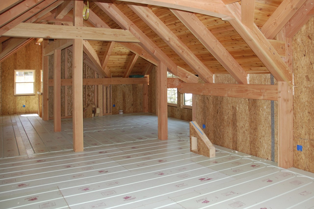 This home looks the part in a winter attic, beam, daylighting, floor, flooring, hardwood, home, house, log cabin, lumber, property, real estate, roof, room, structure, wall, wood, wood flooring, wood stain, orange, brown, gray