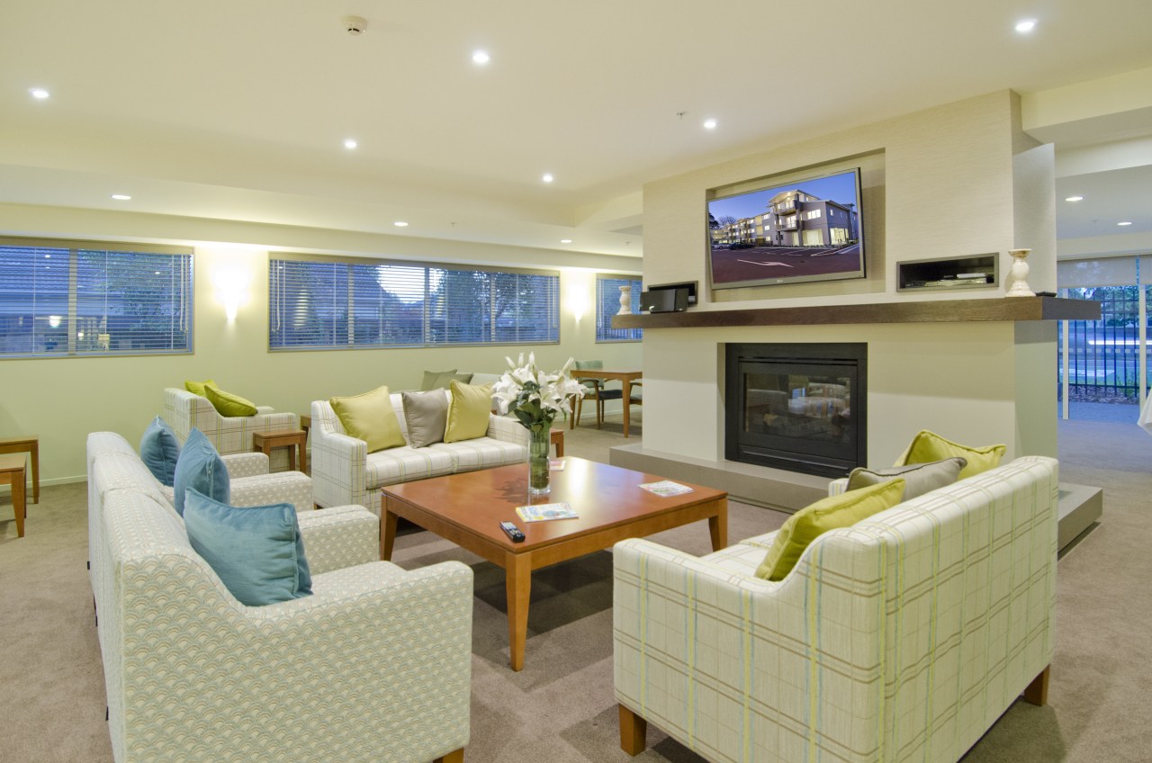 Bupa Parklands on Papanui Village features a wide estate, home, interior design, living room, real estate, room, orange, yellow