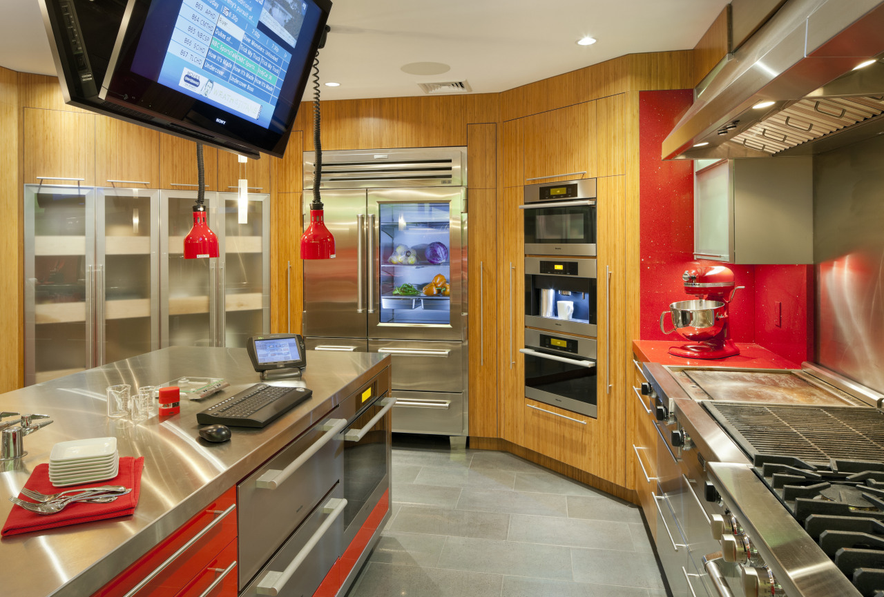 Cabinets in this test kitchen feature a mix countertop, interior design, kitchen, real estate, orange, brown