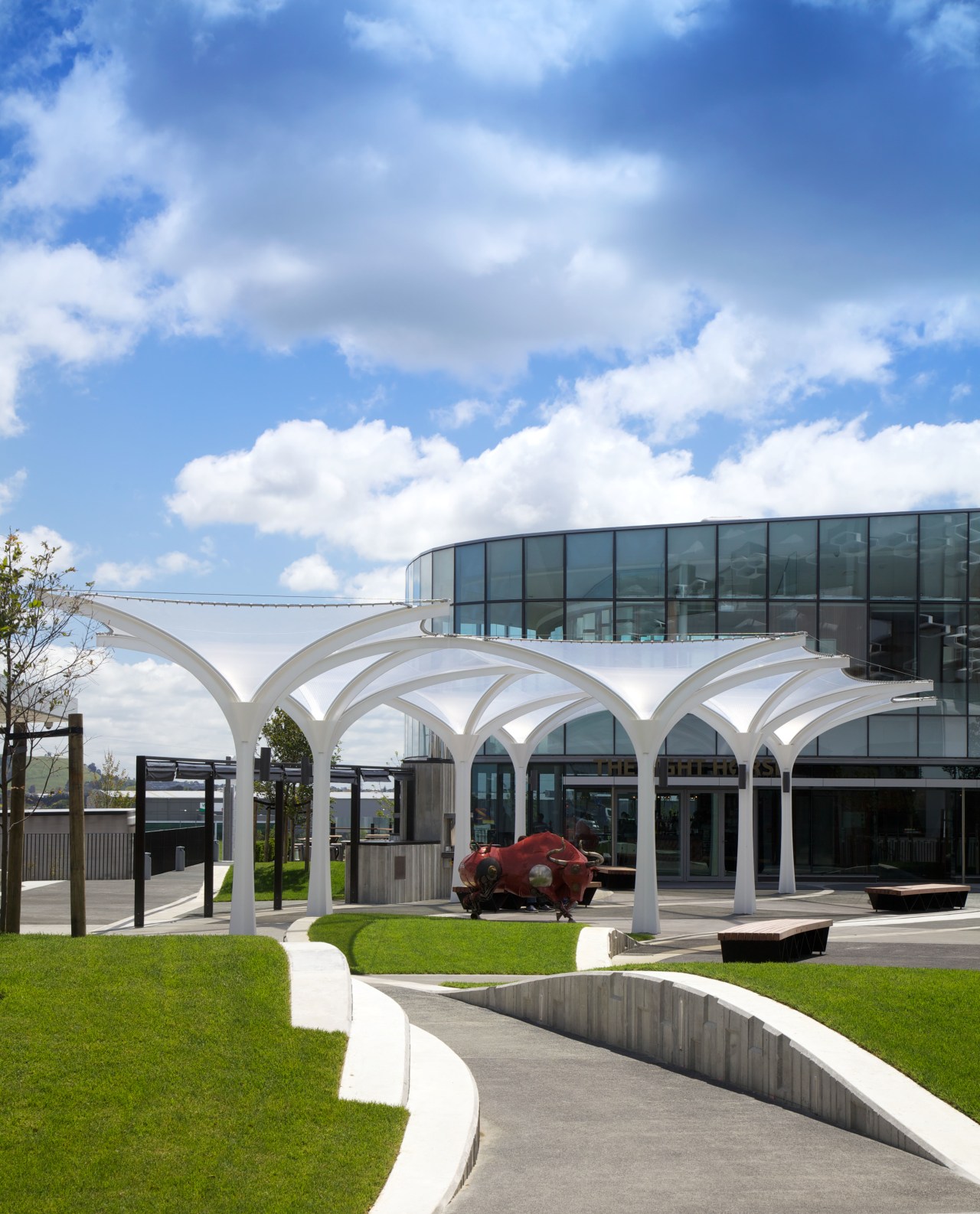 The soaring roof of the Kauwi Interpretive Centre architecture, building, corporate headquarters, estate, facade, house, mixed use, real estate, residential area, sky, teal, white