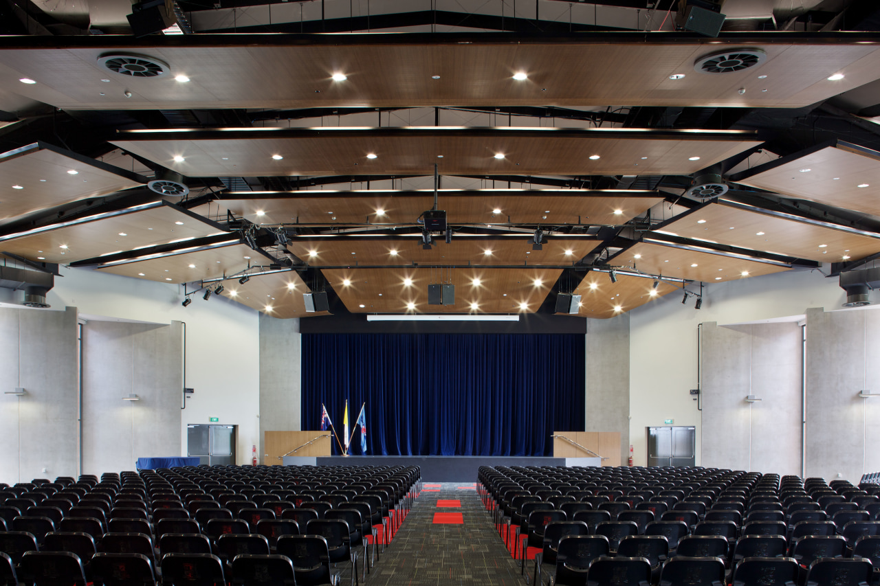 The building framework, protruding stage and attached canopy auditorium, ceiling, convention center, function hall, performing arts center, theatre, black, gray