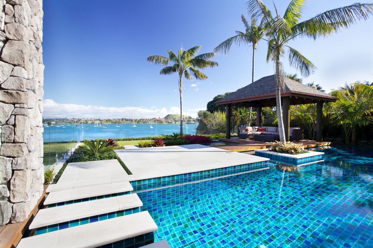 Tropical outdoor area with pergola, sandstone paving and arecales, caribbean, estate, leisure, palm tree, property, real estate, resort, resort town, sea, sky, swimming pool, tropics, vacation, villa, water, teal, white