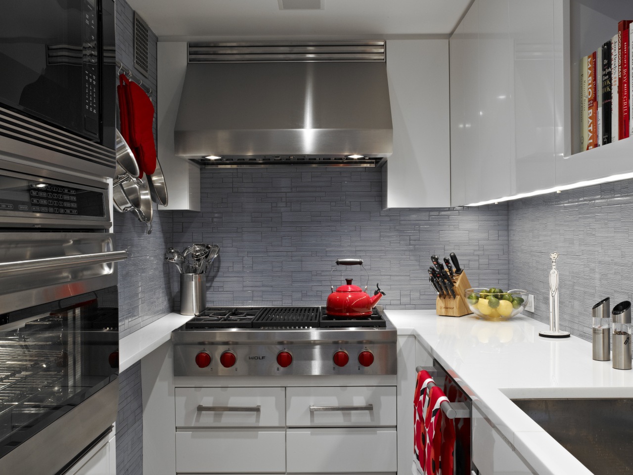 A few red accessories really pop in contrast countertop, interior design, kitchen, room, gray, black